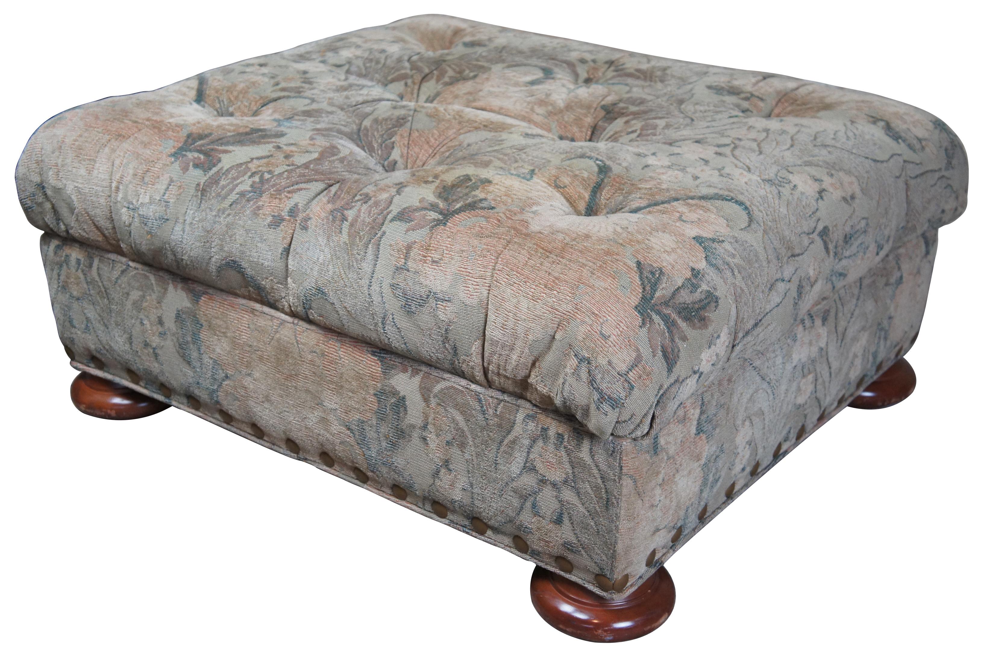 Vintage Baker Furniture ottoman. Features a floral upholstery with tufted top, large nailhead trim and bun feet. Original Baker Furniture crown and rose label on underside. Measure: 34