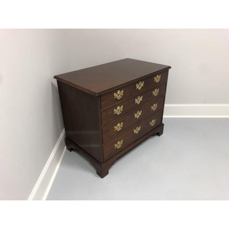 A bachelor chest in solid Mahogany by Baker Furniture Company from their Historic Charleston Reproductions Collection. Chippendale style with bracket feet. Four dovetail drawers with brass hardware. Made in the USA in the late 20th