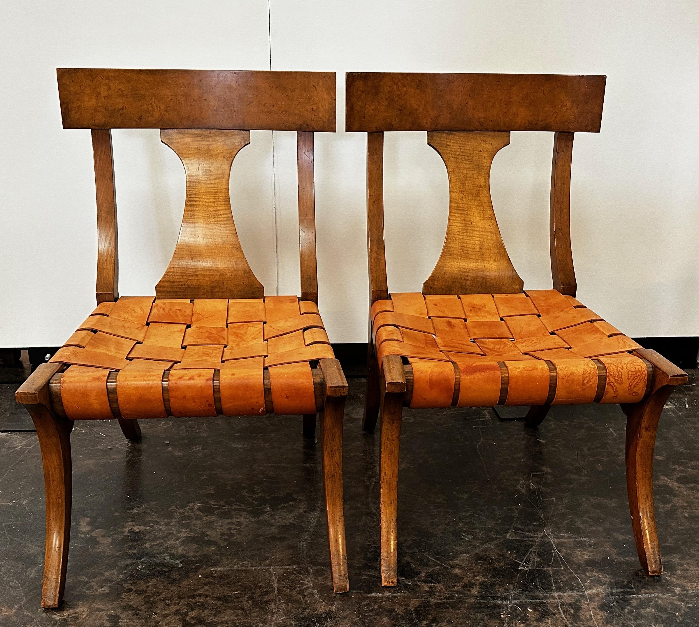These beautiful and hard to find Baker Klismos chairs are in a class of their own.  Vintage and in great condition with a curved back, leather strapping and a sweeping leg.  A special touch to these Klismos chairs are the small wings in each corner