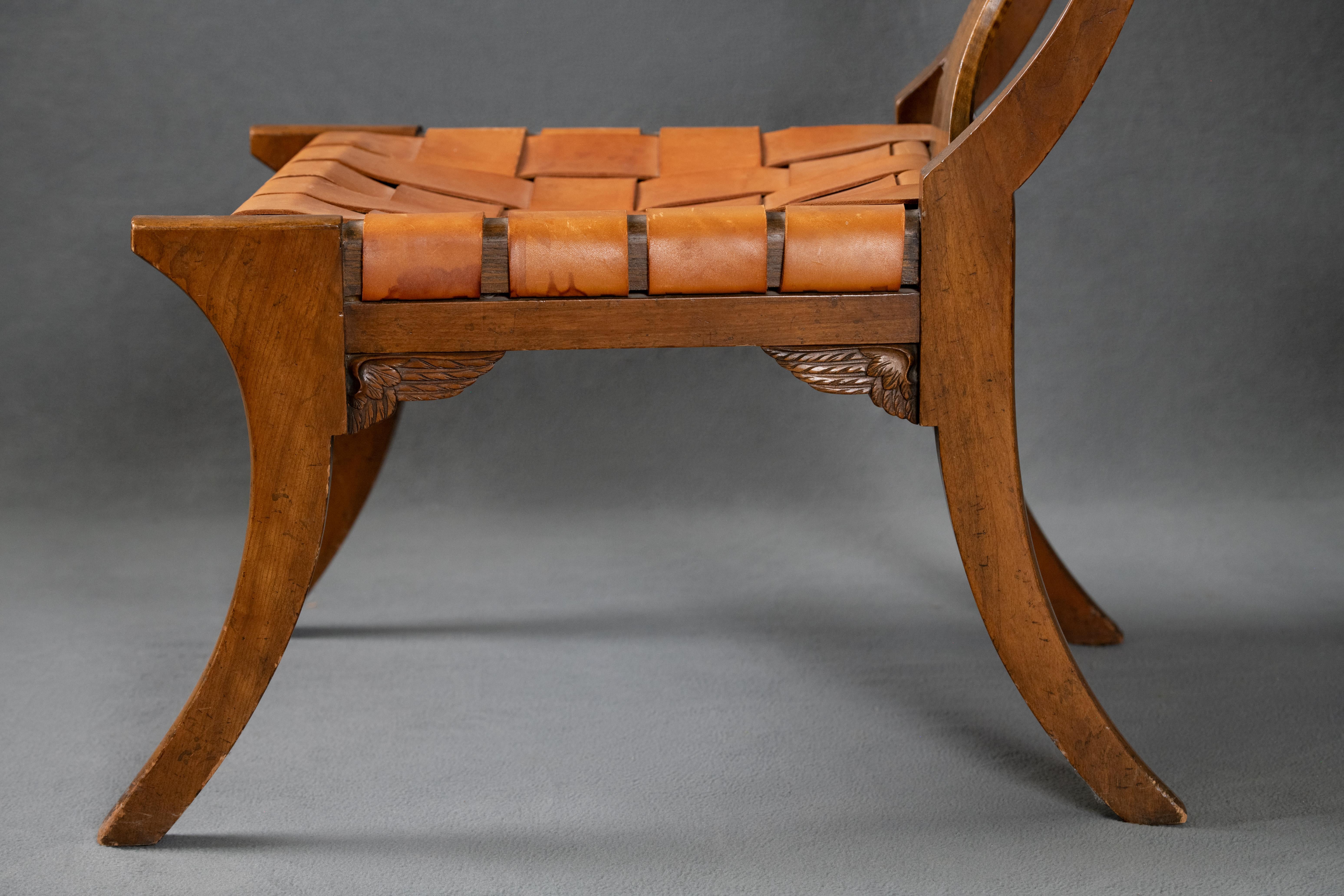 These beautiful and hard to find Baker Klismos chairs are in a class of their own.  Vintage and in great condition with a curved back, leather strapping and a sweeping leg.  A special touch to these Klismos chairs are the small wings in each corner
