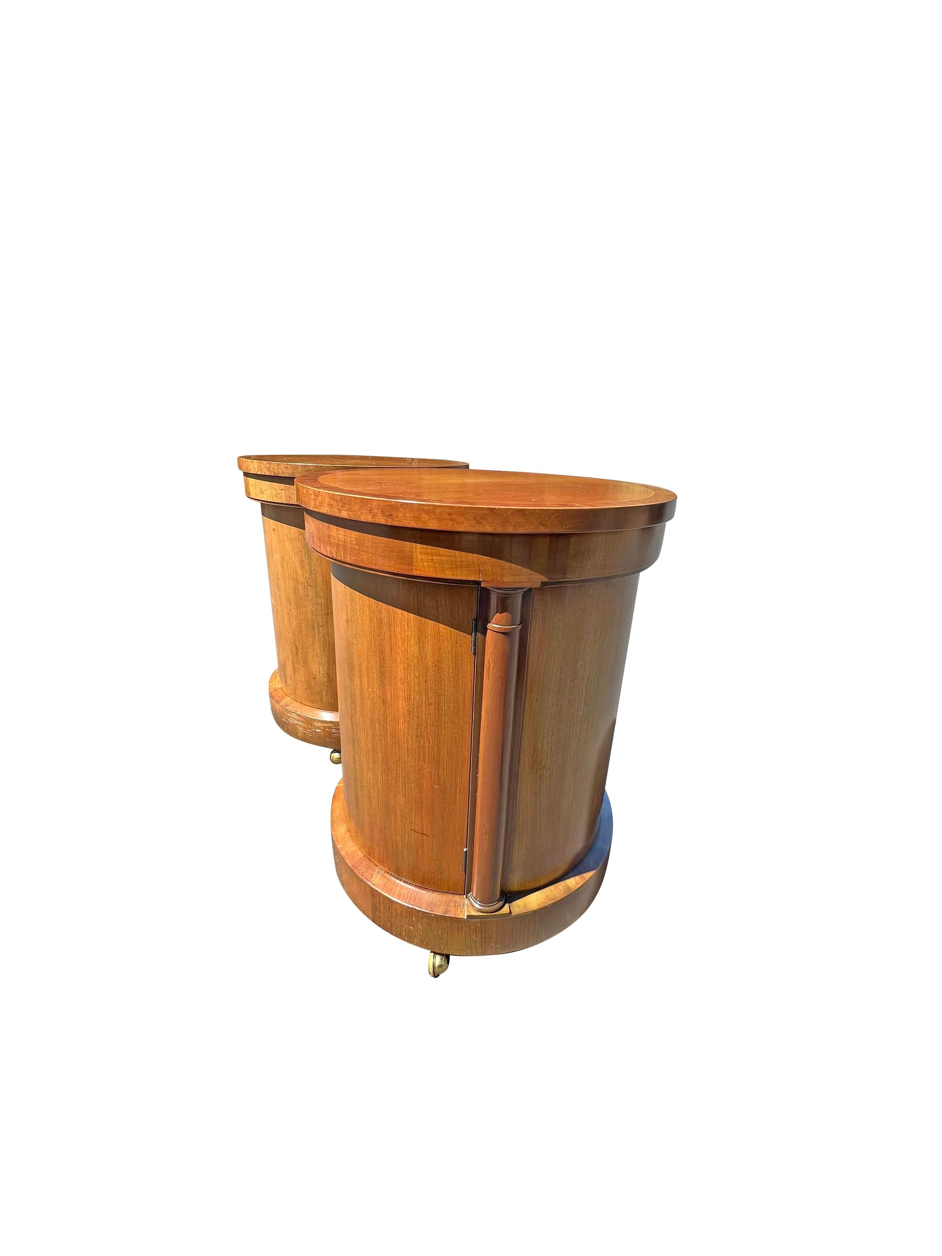 A Pair of Vintage Baker Nightstands: Timeless Elegance.

These stunning vintage nightstands from Baker Furniture Company are a testament to the brand's commitment to quality and timeless design. The drum-style design, combined with the practical