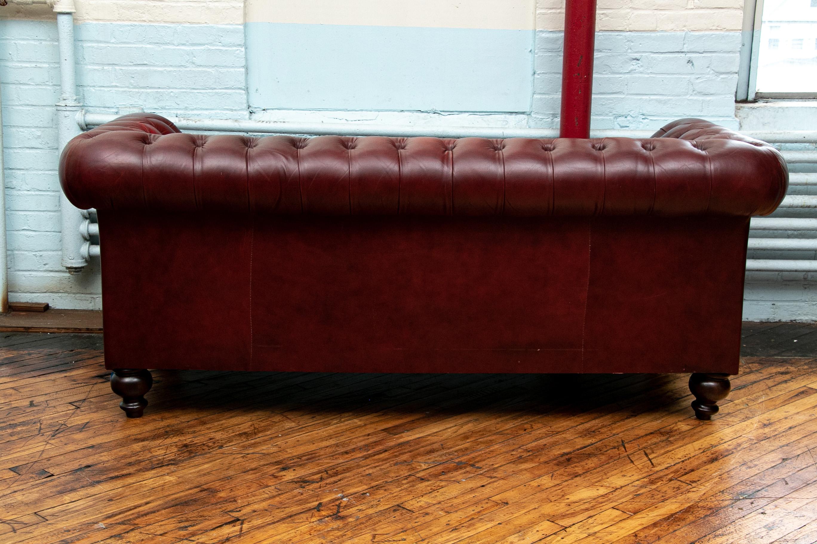 oxblood red leather sofa