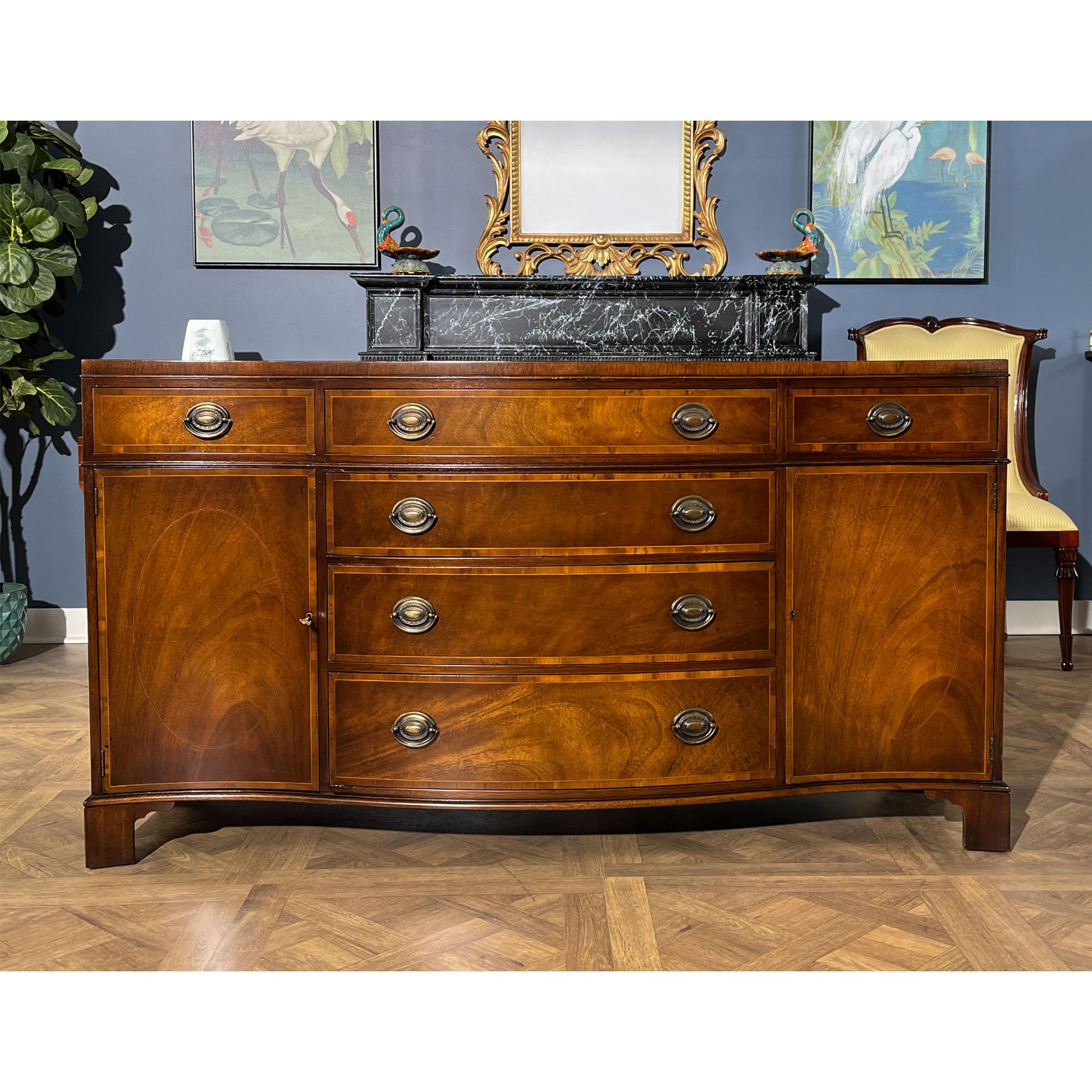 A Vintage Baker Serpentine Sideboard brought to you by Niagara Furniture. A classic serpentine shape this Sideboard features six total drawers and two cabinet doors below to give it a traditional  appearance that is both functional and attractive.