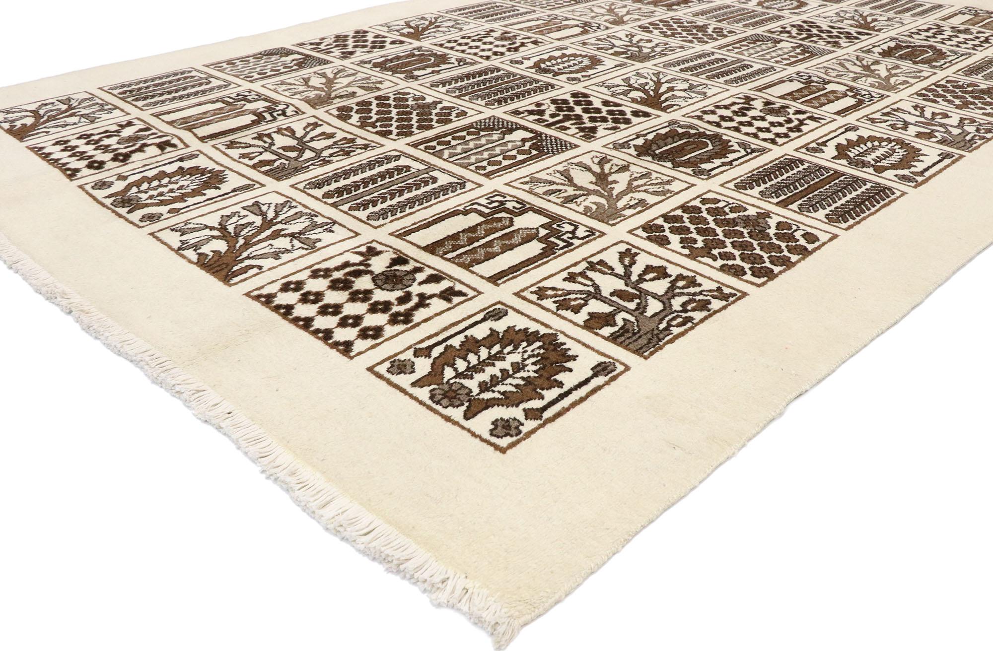 72028 Vintage Bakhtiari Persian Rug with Garden Design with Black Forest Style. A beautiful, unique garden design is on display in this vintage Bakhtiari Persian rug. Each individual square compartment is 