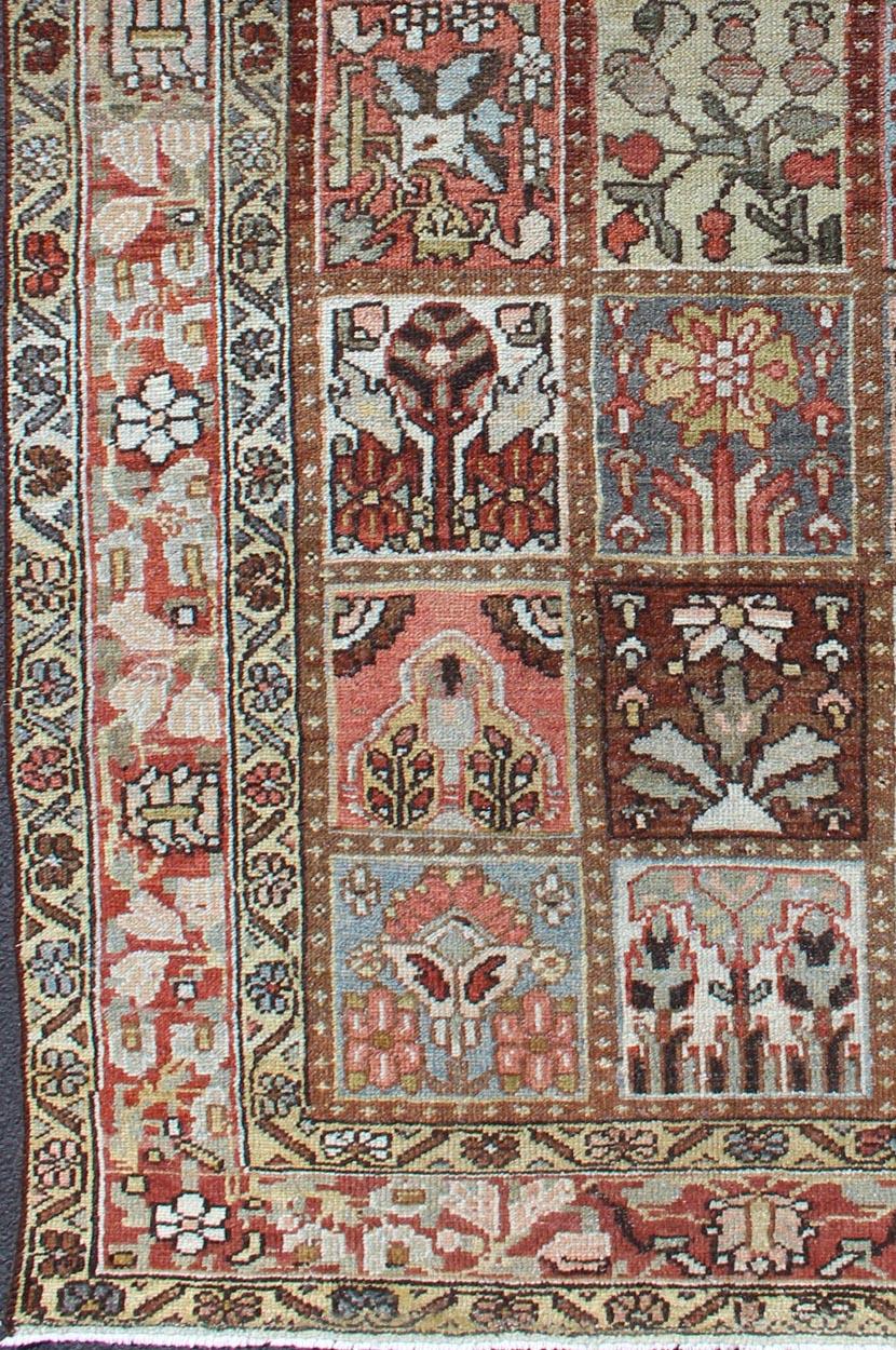 Persian vintage carpet with colorful garden images, rug ca-2779, country of origin / type: Iran / Bakhtiari, circa mid-20th century

This vintage Bakhtiari rug from mid-20th century Persia features design of various panes featuring garden figures,