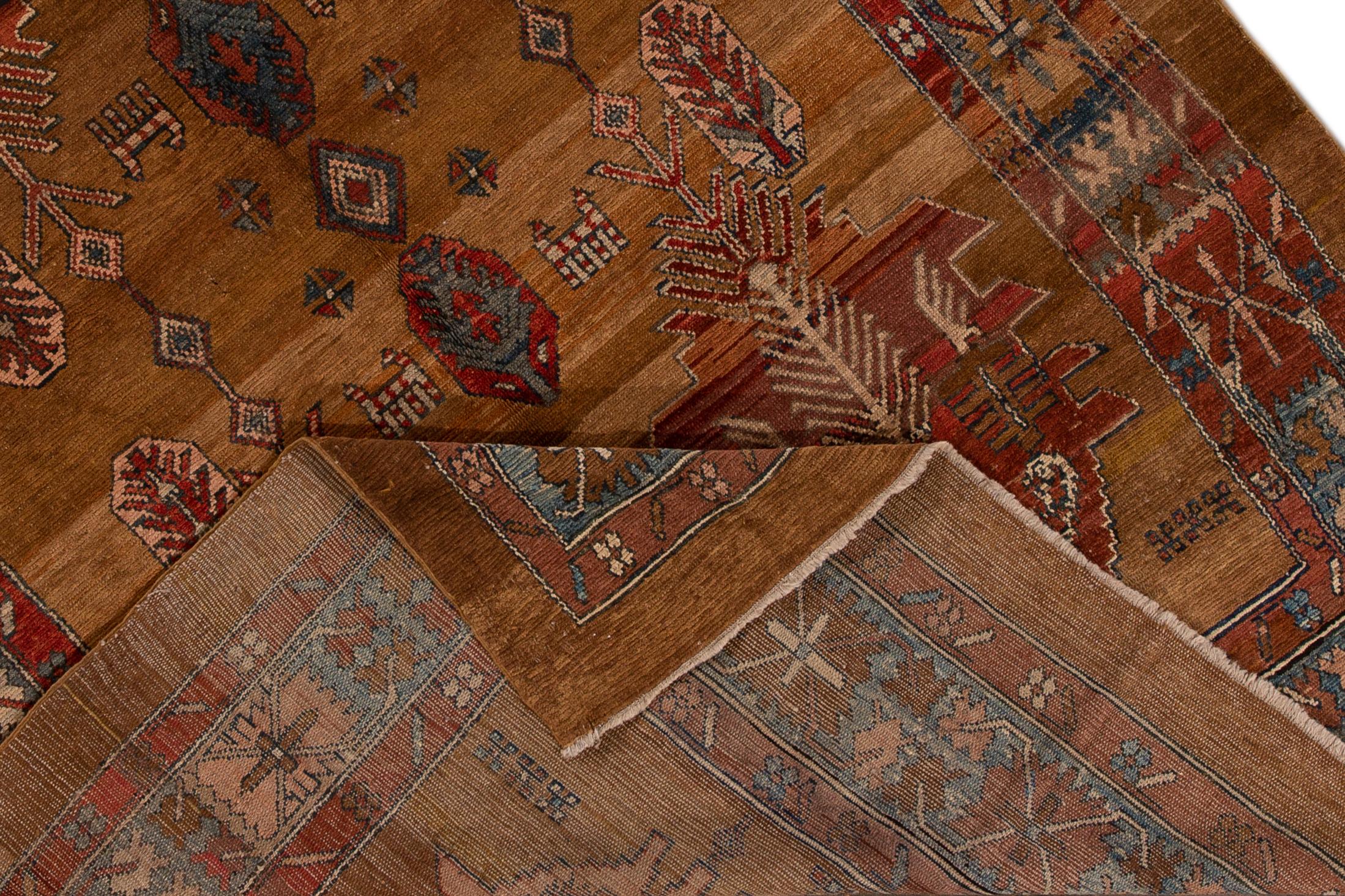 Beautiful vintage Persian Bakshaish hand knotted wool rug with the brownfield, and multi-color accents in an all-over tribal design.


This rug measures: 7'5