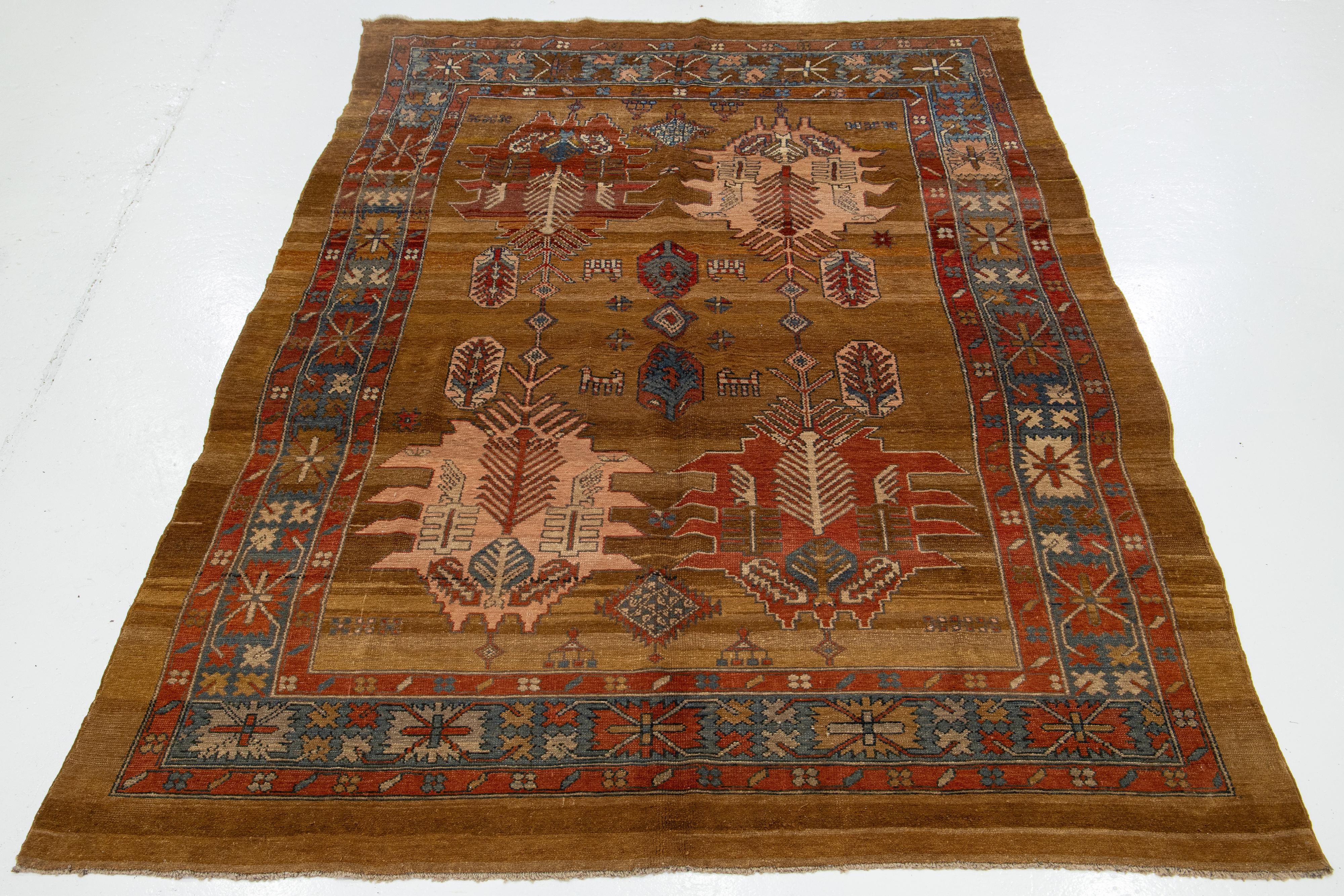 Beautiful vintage Persian Bakshaish hand knotted wool rug with the brownfield, and multi-color accents in an all-over tribal design.


This rug measures: 7'5