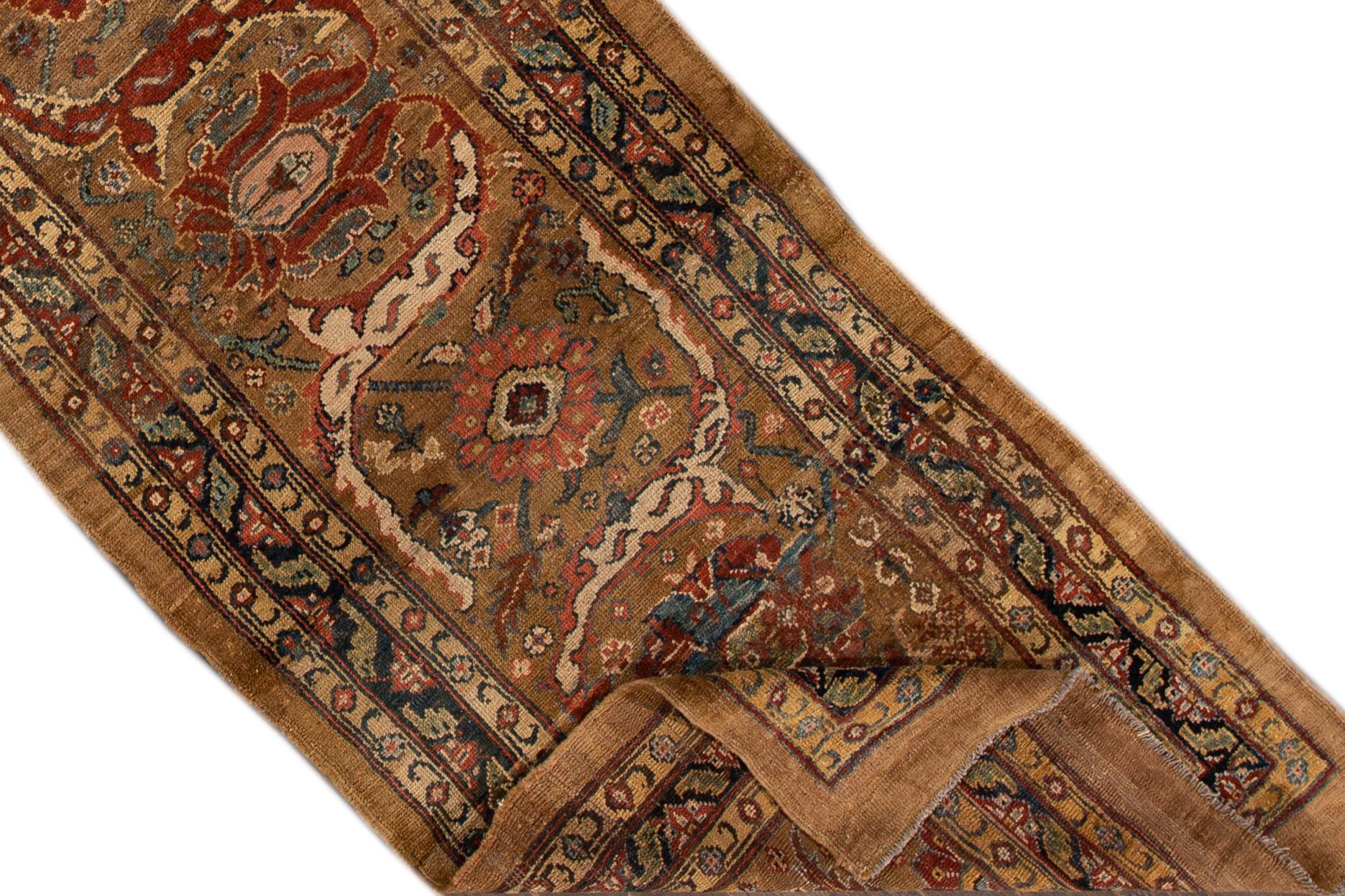 Beautiful vintage Bakshaish wool rug with a peach field, the fame of brown. This rug has multi-color accents in an all-over geometric design.

This rug measures 2' 11