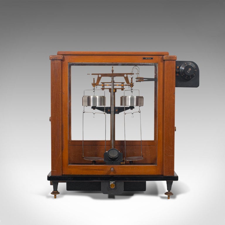 This is a vintage analytical balance. An English, mahogany cased set of scientific scales by Stanton Instruments of London, dating to the mid-20th century, circa 1960.

Beguiling vintage scientific instrument - the model Inst 30/B
Displaying a