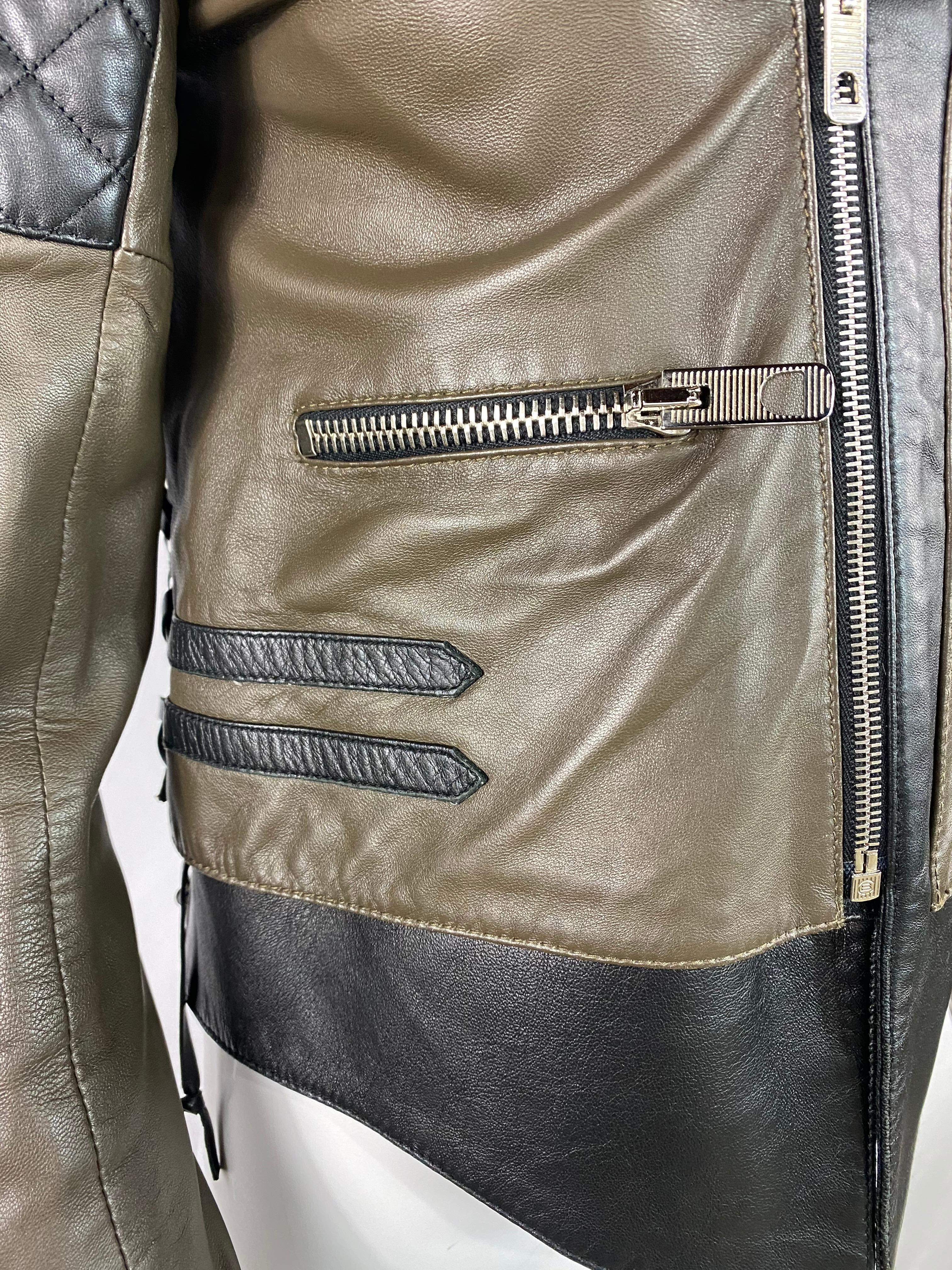 Product details:

The jacket is designed by Balenciaga, it is made out of 100% lamb leather with double rayon lining. It features silver tone hardware, front zip closure, front pockets with zipper closure, side black leather crossed laces, zipper