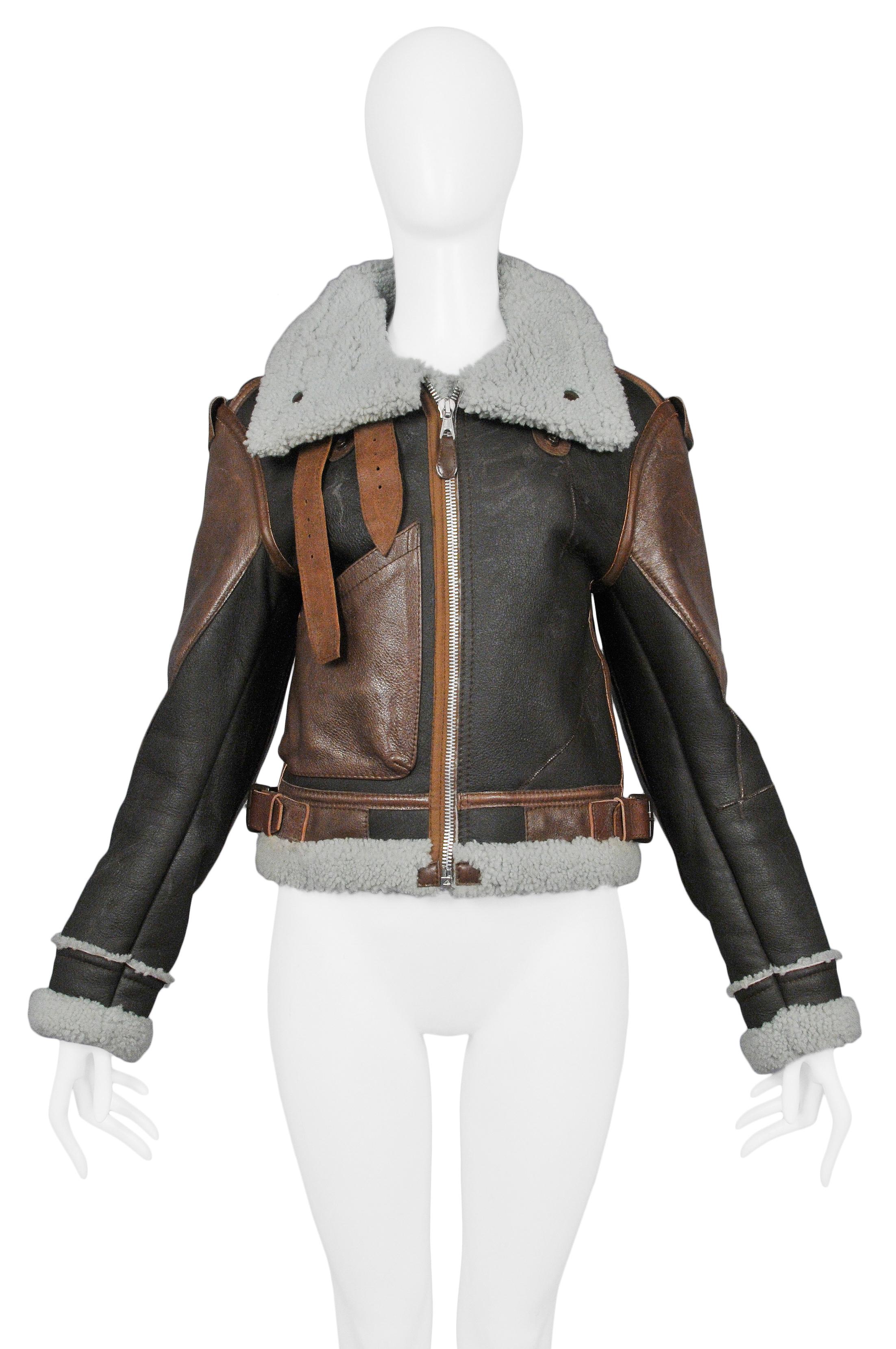 We are excited to offer a vintage Nicolas Ghesquière for Balenciaga brown leather & mint shearling 'Palma' aviator jacket featuring leather straps and dark metal buckles, shearling trim, dark metal snaps, and chainlink, multi-tone brown panels and