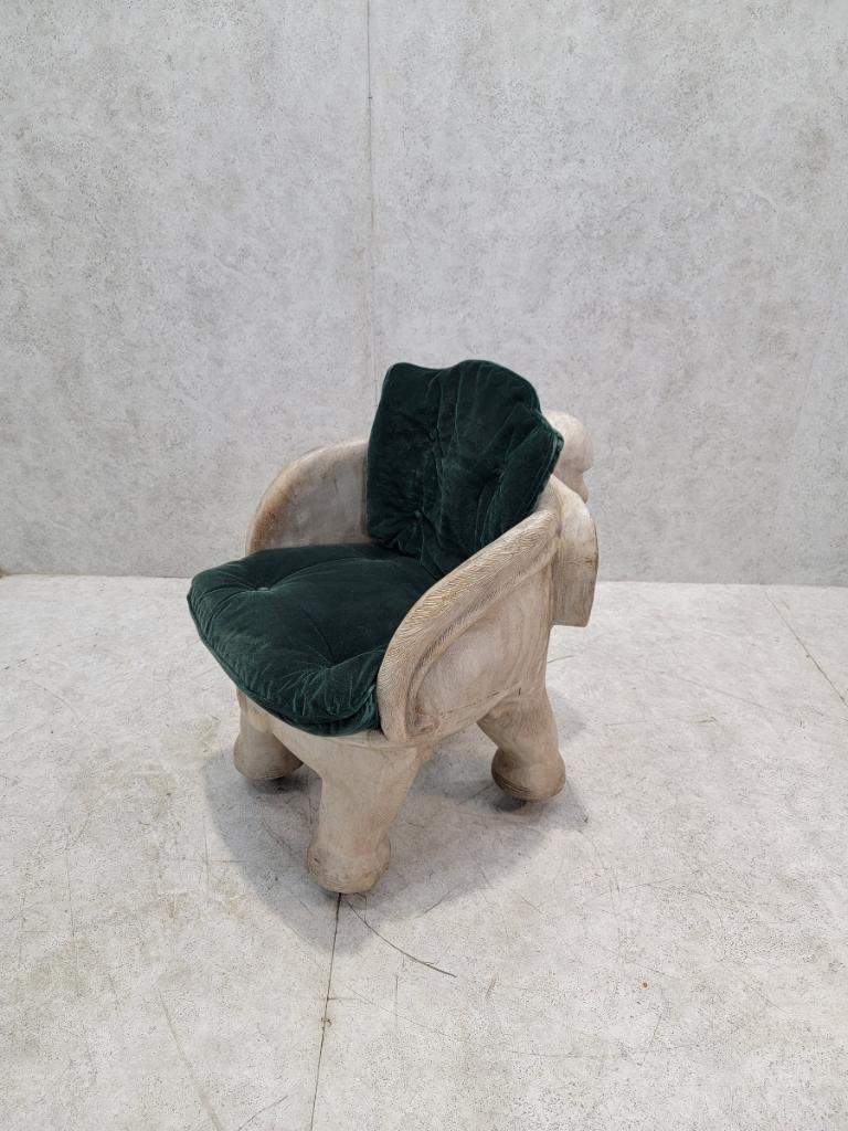 Vintage Balinese Wood Carved Elephant Chair

Stunning beautifully detailed hand carved 1930s Balinese elephant sculpted accent chair. This beautiful piece has been hand carved from one solid piece of timber with dug out back for comfortable full