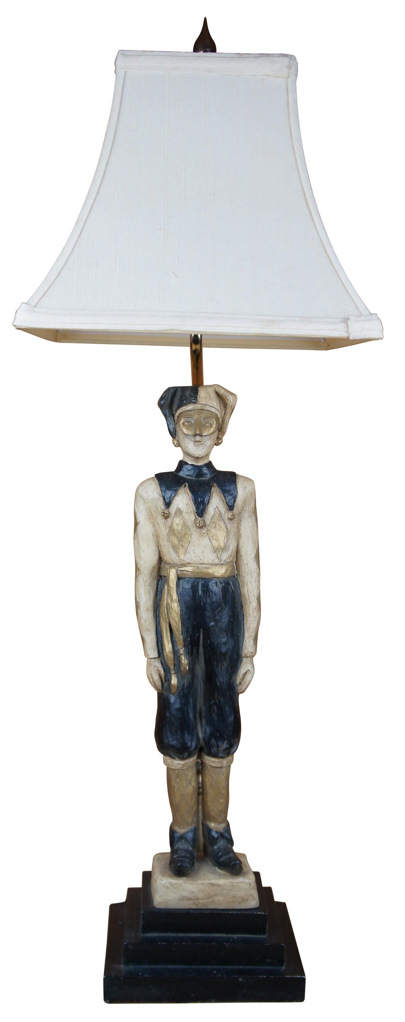 Vintage Ballard Design jester or harlequin lamp featuring a stoic figure in black and gold standing on a stacked base.

Measures: lamp- 6.125