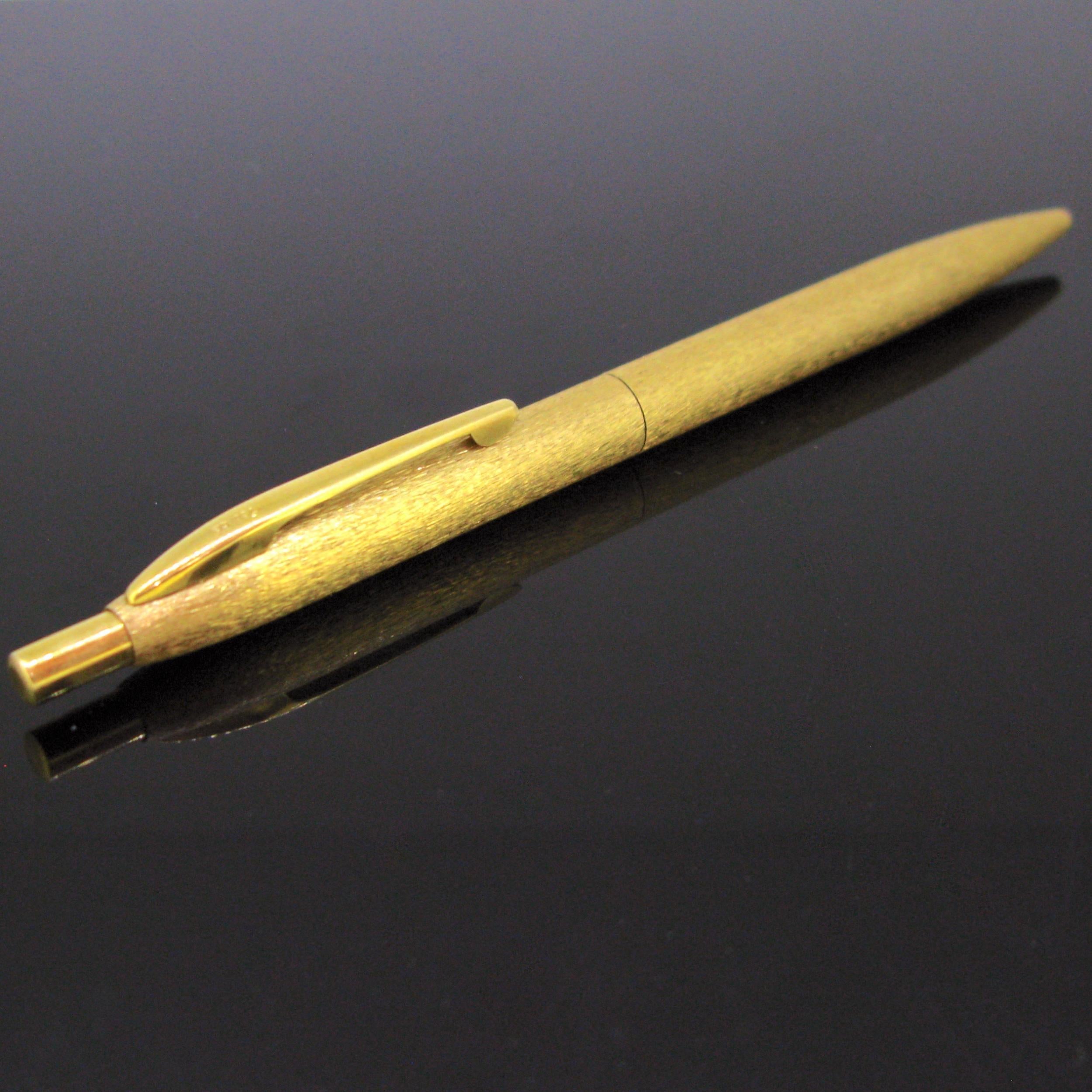 Weight:	26gr



Metal:		18kt yellow Gold



	
Condition:	Very Good



Comments:	This nice vintage ballpoint pen is made in 18kt yellow brushed gold. It is marked 750 for 18kt gold. It is in vey good vintage condition. 



Dimensions:	 Height: 12,8cm