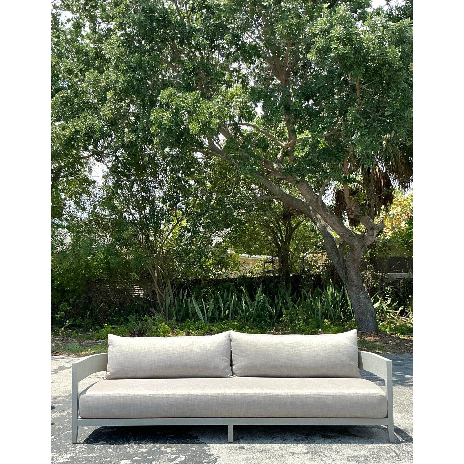 Add a refined touch of modern elegance to your space with this vintage “Balmain” sofa After RH blending coastal Boho vibes with Restoration Hardware’s signature luxe minimalism. The low-profile silhouette features crisp lines and subtly curved arms