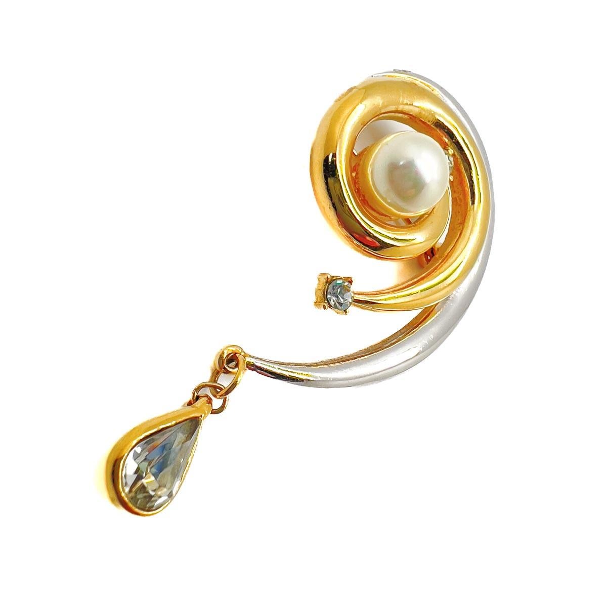 A Vintage Balmain Swirl Brooch. A stunning lapel adornment from the great Parisian house. Featuring mixed metals for an eye catching look and finished to perfection with crystal and pearl. A timeless find that will always have the Parisian style