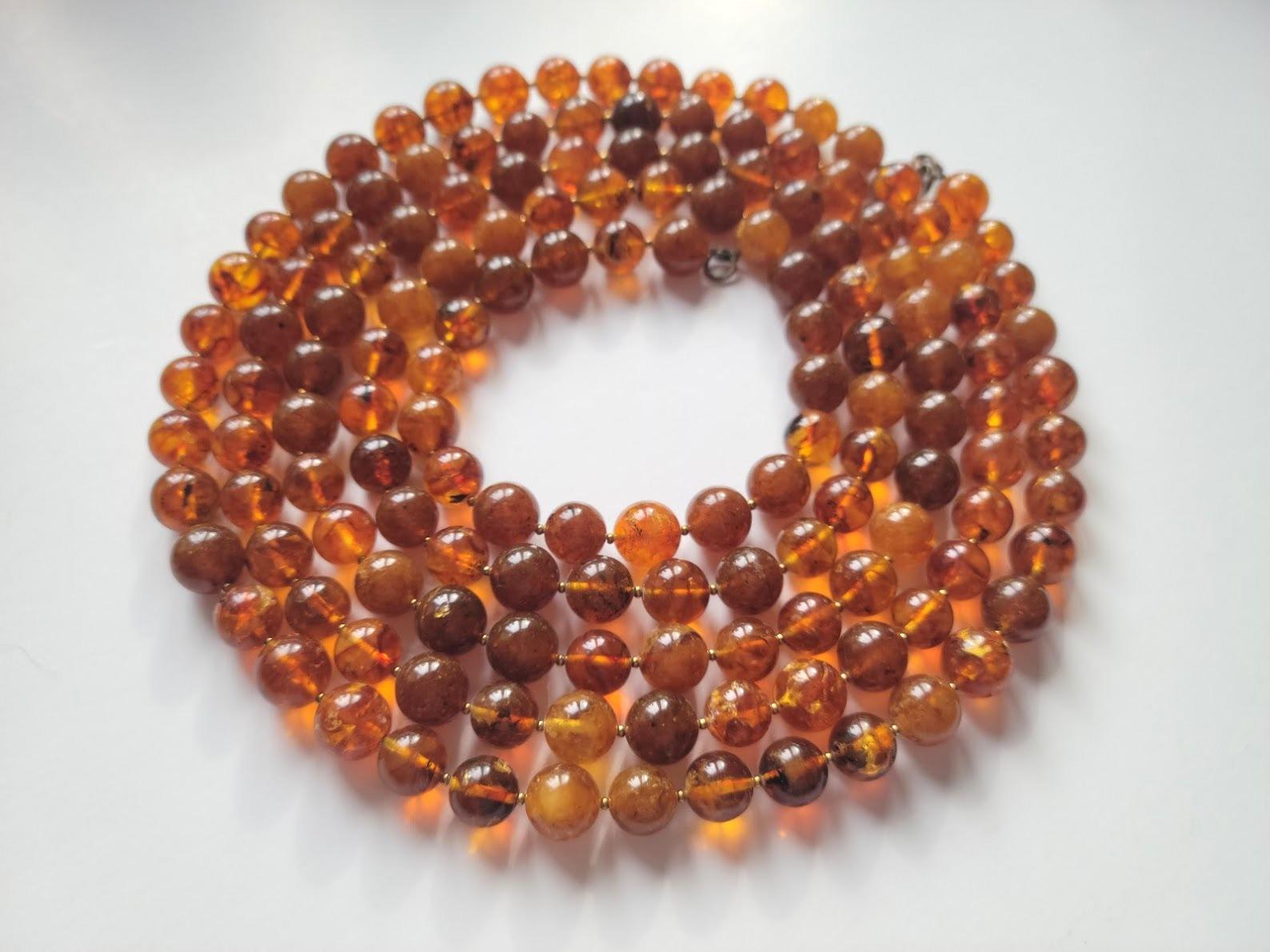 The length of the necklace is 72 inches (183 cm).
Beautiful beads from rare genuine Baltic amber from Kaliningrad Amber Factory, Russia.
The size of the smooth round amber beads is 12mm.
The beads are semi-transparent. The color of amber is color is