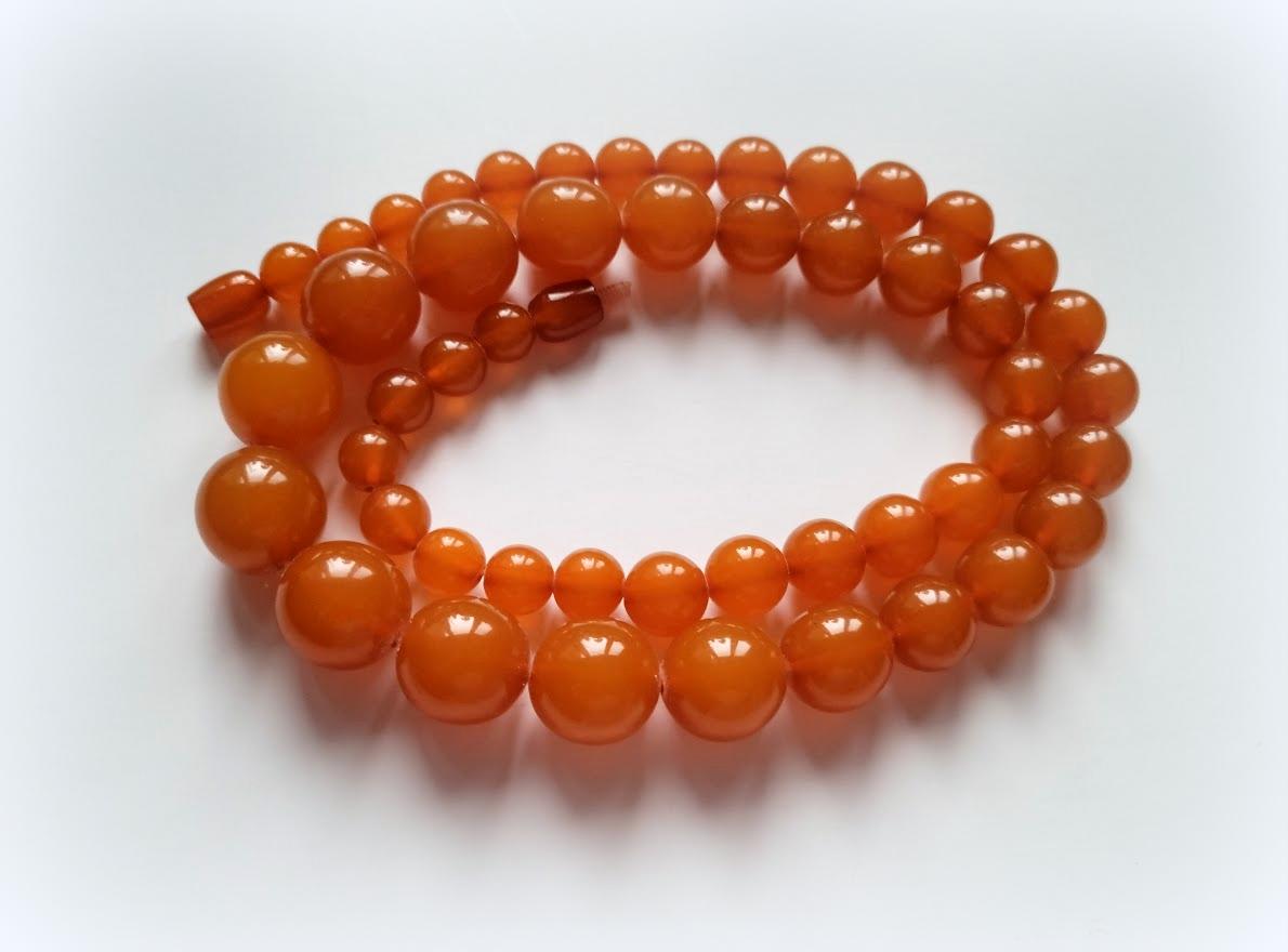 Amazing Amber! Such a high-quality amber press has a precious feature - it is patented exactly like natural amber! 

The length of the amber necklace is 25 inches (63.5 cm). The size of beads varies from 9.5 to 17.5 mm.
The color of amber is deep,