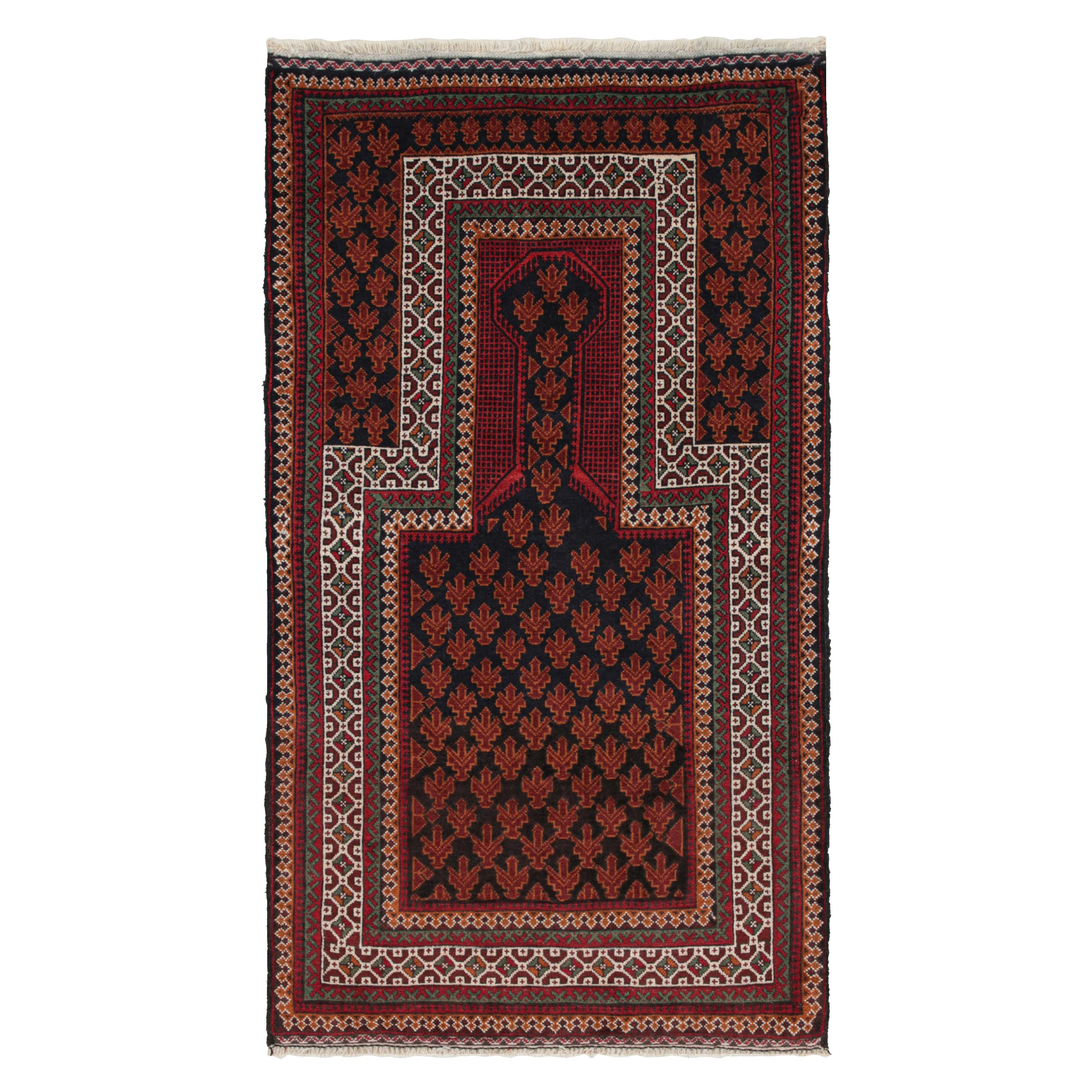 Tapis afghan vintage Baluch à motifs noirs, rouges, orange et blancs de Rug & Kilim en vente