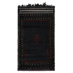 Alfombra afgana Baluch vintage con motivos tribales en azul, negro y rojo de Rug & Kilim