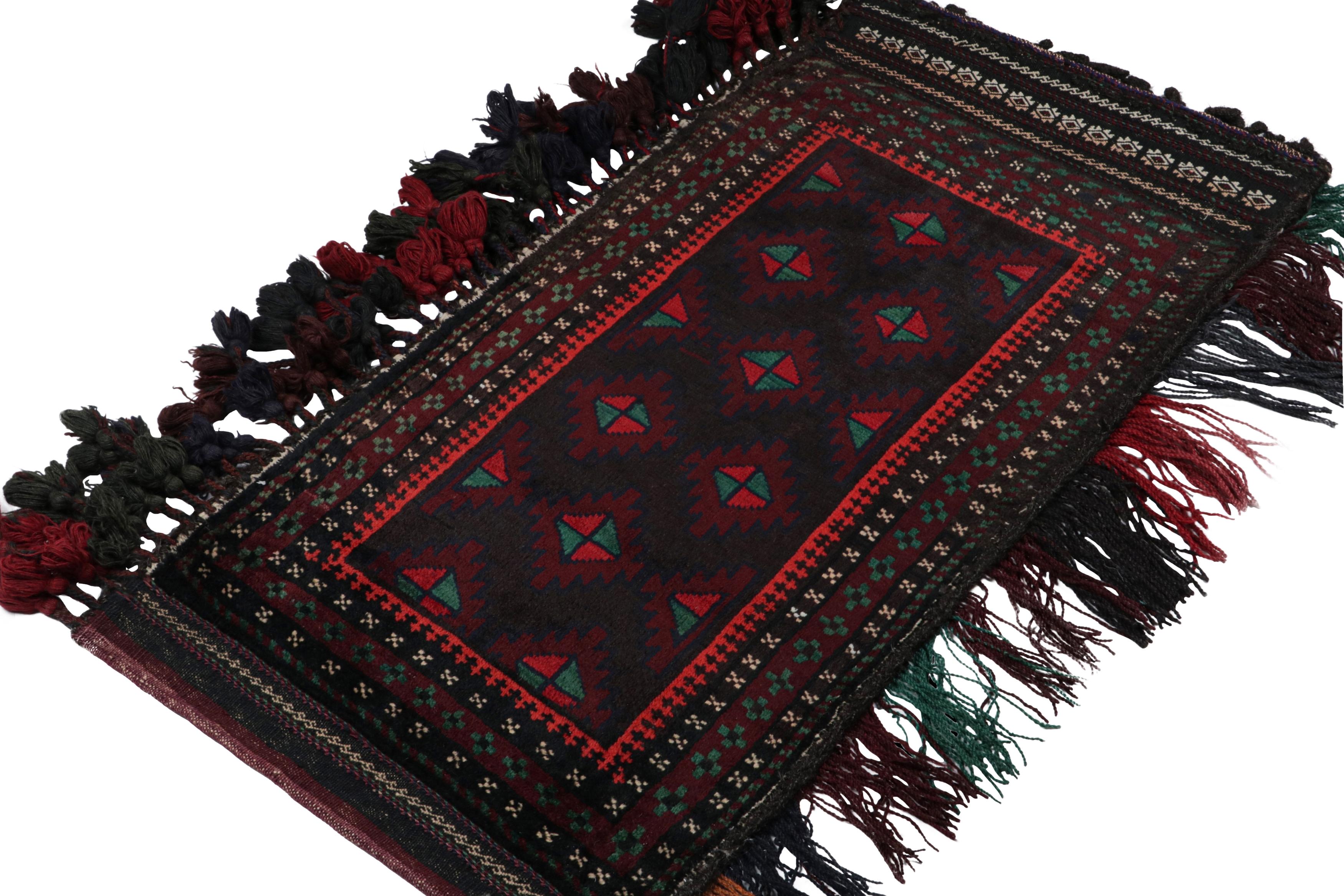 Hand-knotted in wool, this 2x4 Baluch Persian rug of the 1950s is the latest to enter Rug & Kilim’s prestigious Antique & Vintage collection.

On the Design:

The vintage Baluch rug features tribal patterns in rich tones of red & green on black. The