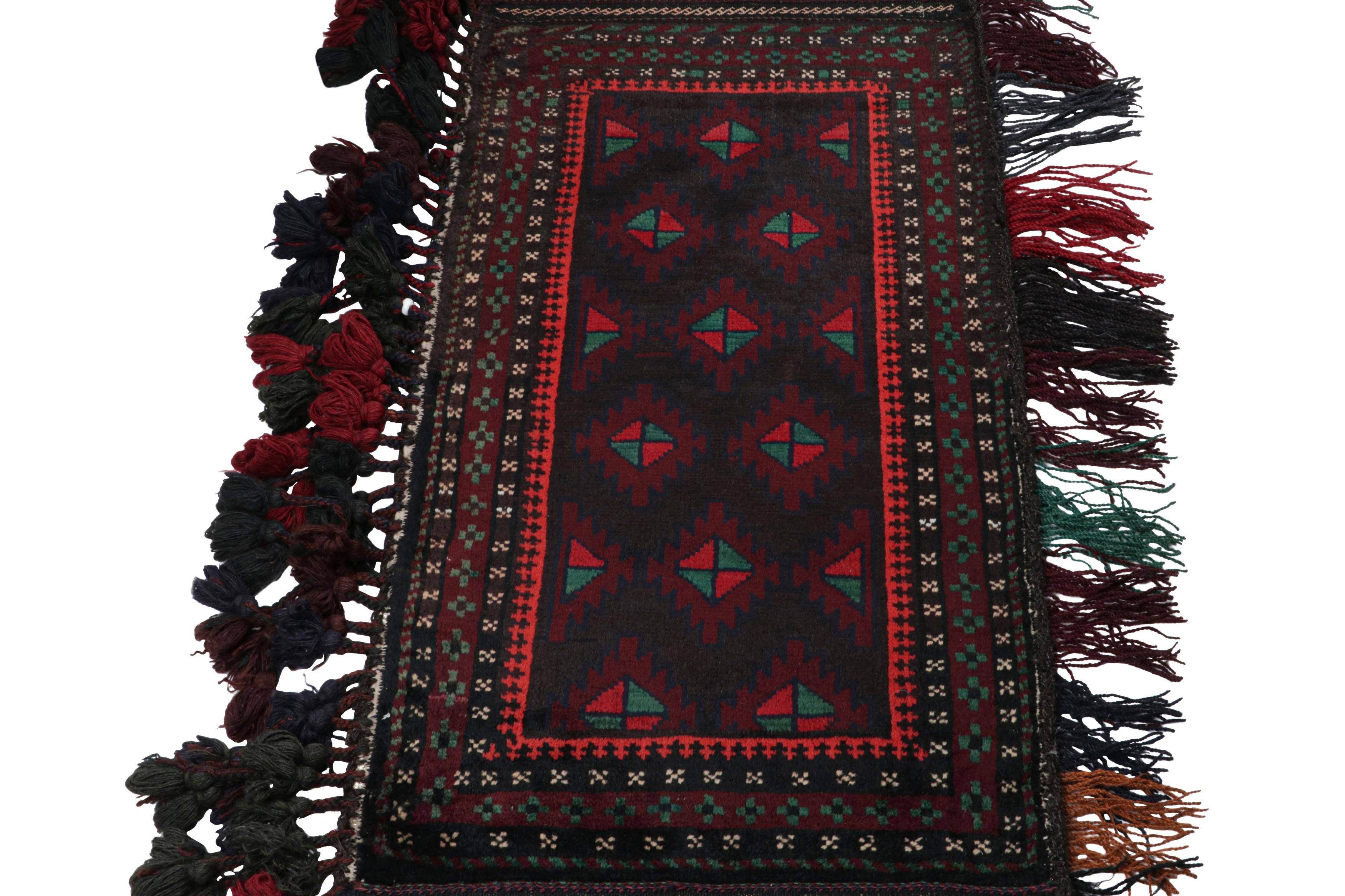 Tribal Vintage Baluch Persian rug in Black, Red & Green Patterns from Rug & Kilim For Sale