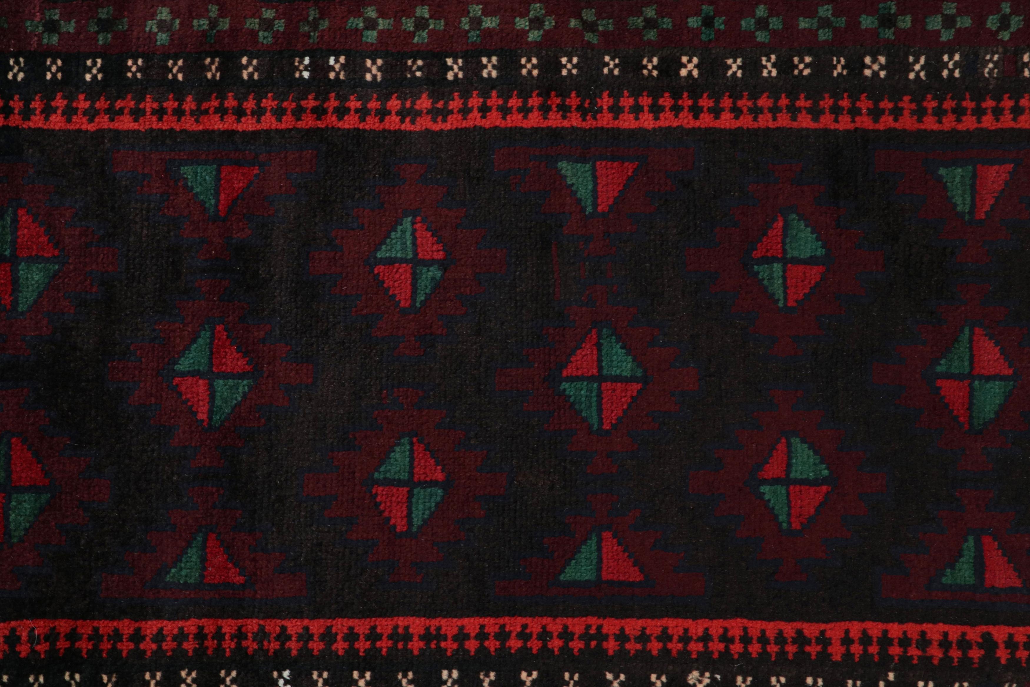 Mid-20th Century Vintage Baluch Persian rug in Black, Red & Green Patterns from Rug & Kilim For Sale