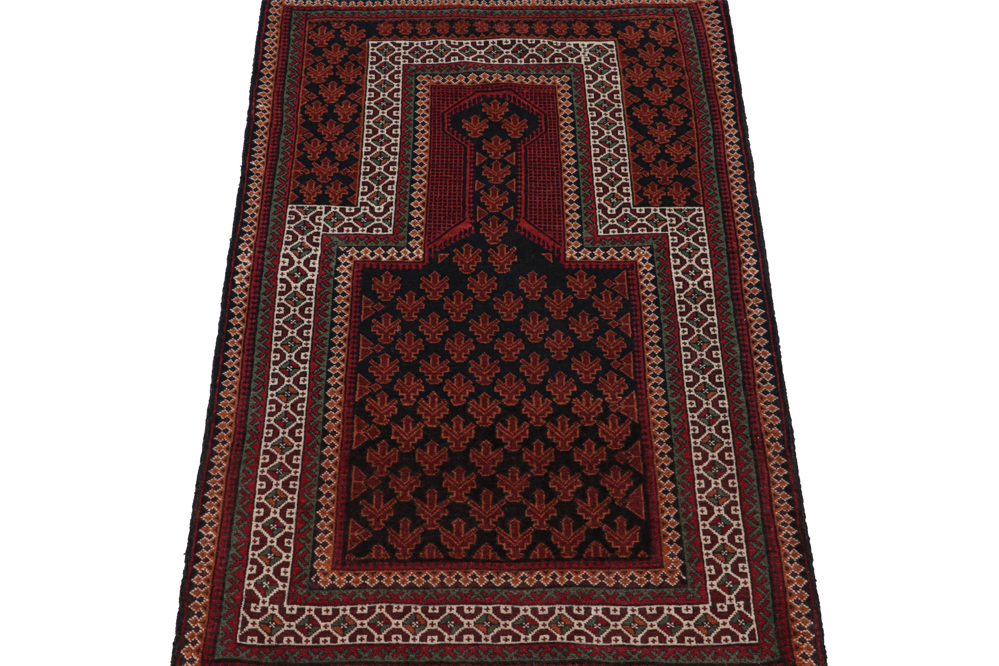 Tribal Vintage Baluch Persian rug in Black, Red, Orange, White Pattern from Rug & Kilim For Sale