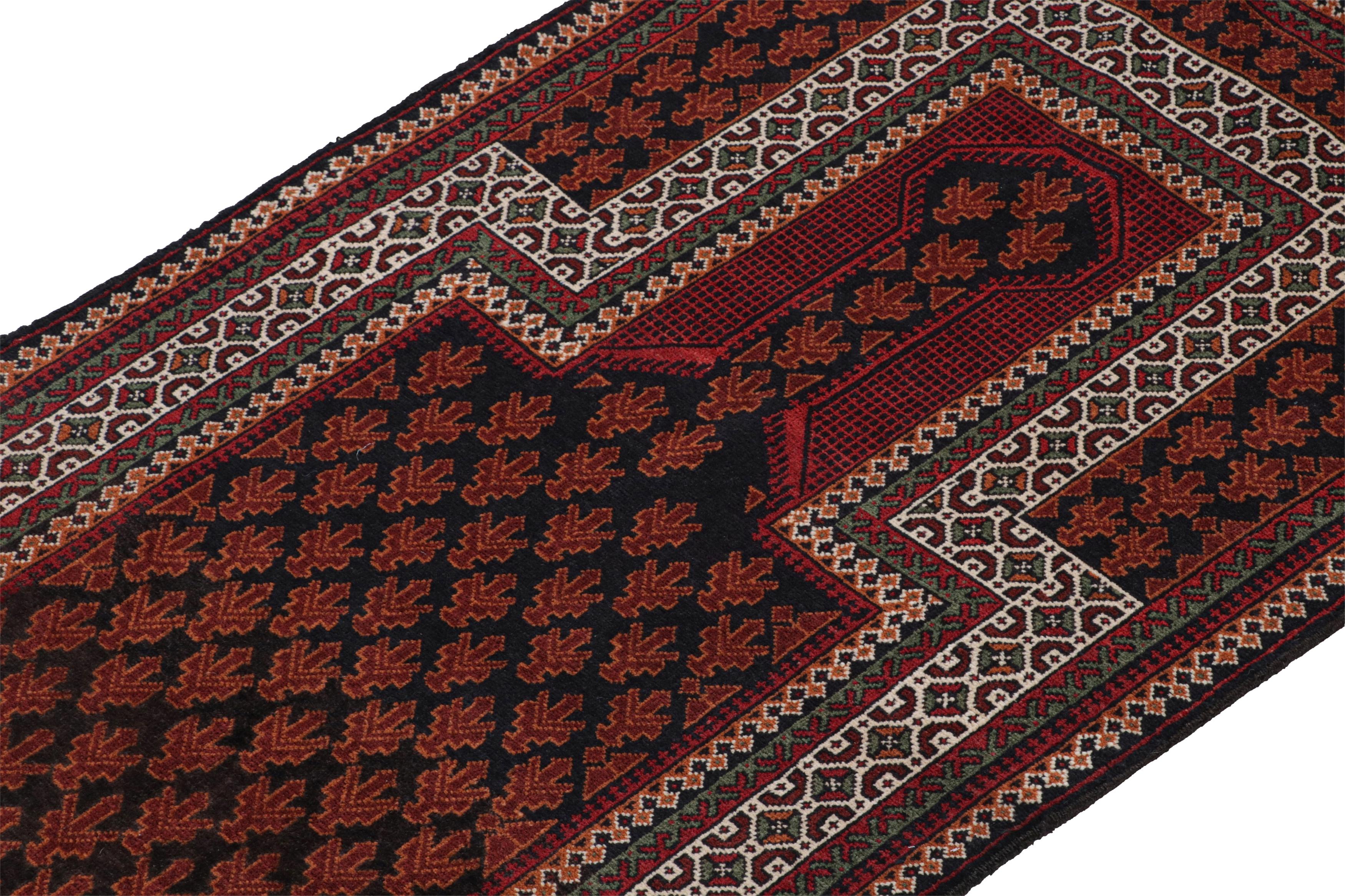 Hand-Knotted Vintage Baluch Persian rug in Black, Red, Orange, White Pattern from Rug & Kilim For Sale