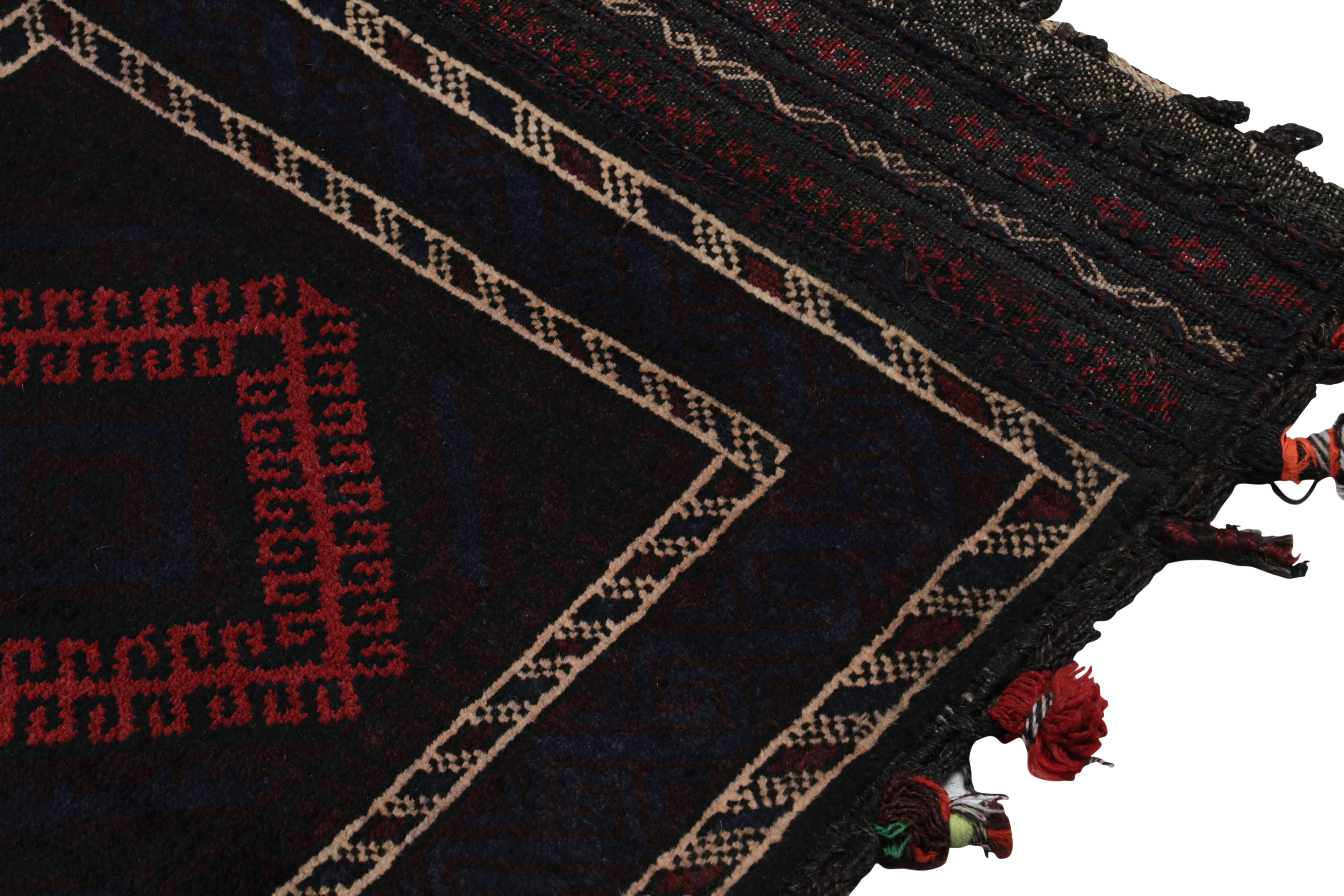 Mid-20th Century Vintage Baluch Persian rug in Black & Red Tribal Patterns from Rug & Kilim For Sale