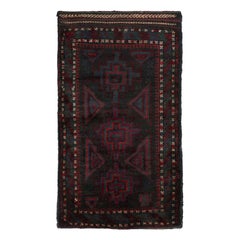Vintage Baluch Persian rug in Black 
Red Tribal Patterns from Rug 
Kilim