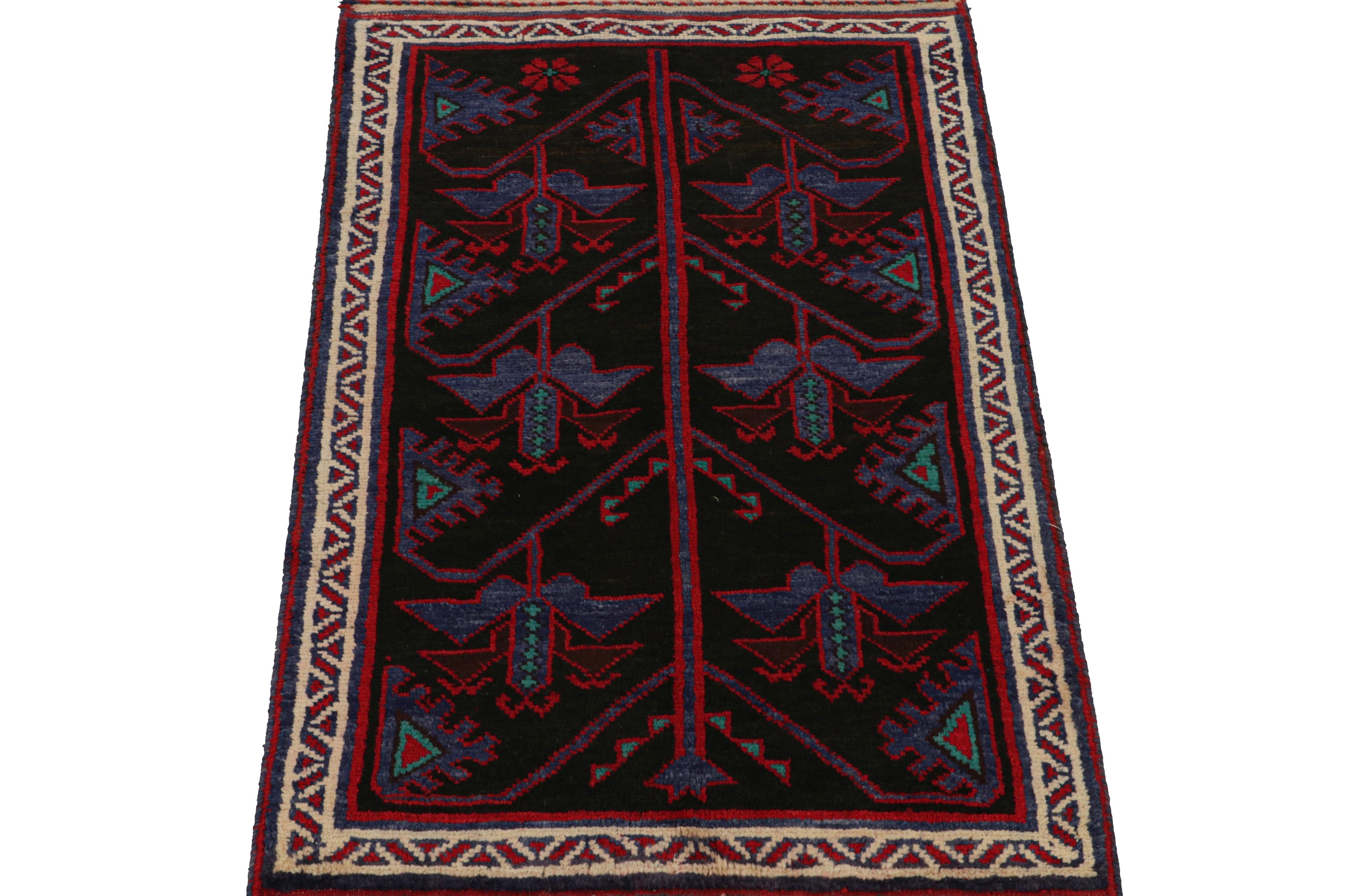 Tribal Vintage Baluch Persian rug in Black with Red & Blue Patterns from Rug & Kilim For Sale