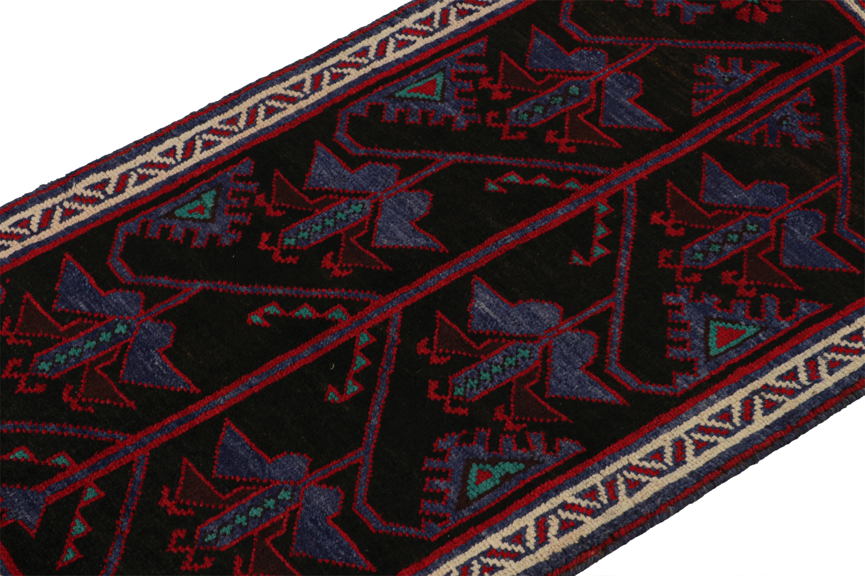 Hand-Knotted Vintage Baluch Persian rug in Black with Red & Blue Patterns from Rug & Kilim For Sale