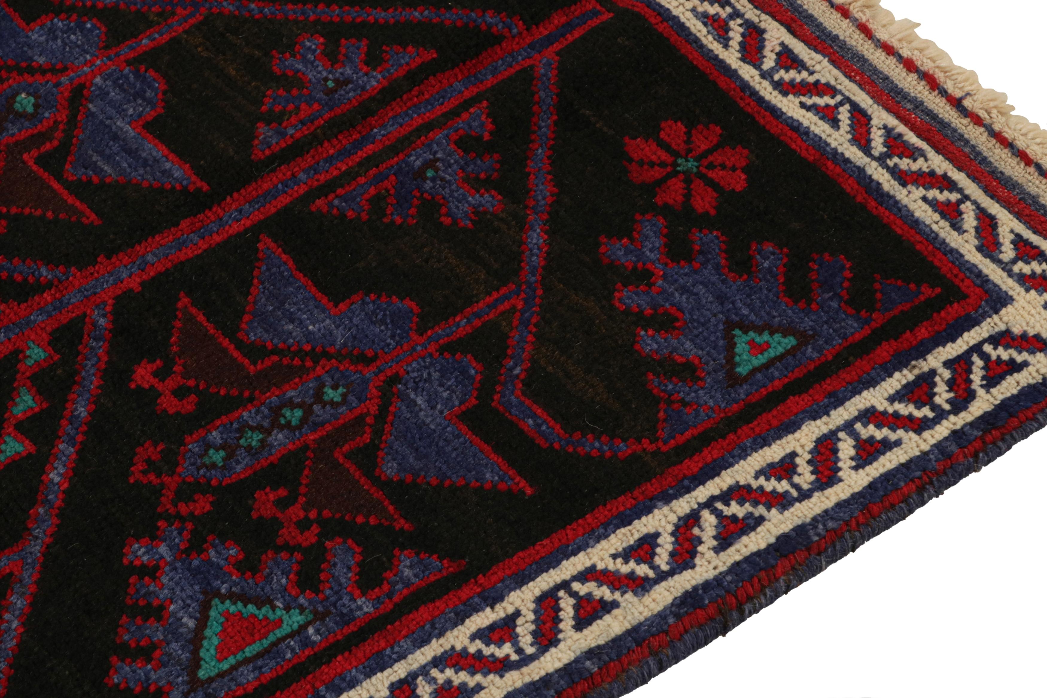 Vintage Baluch Persian rug in Black with Red & Blue Patterns from Rug & Kilim In Good Condition For Sale In Long Island City, NY