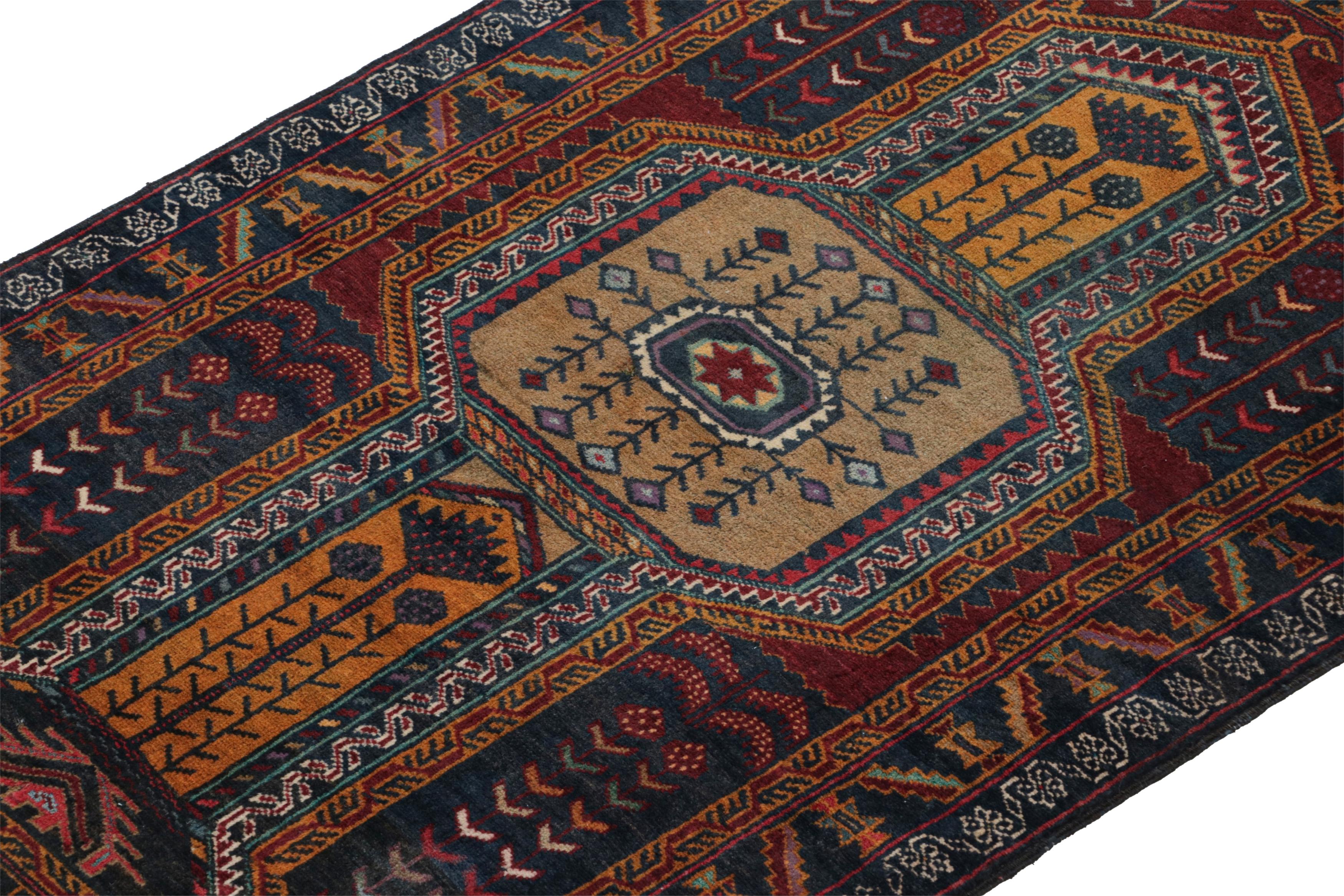 Hand-Knotted Vintage Baluch Persian rug in Blue, Brown, Gold & Red Pattern from Rug & Kilim For Sale