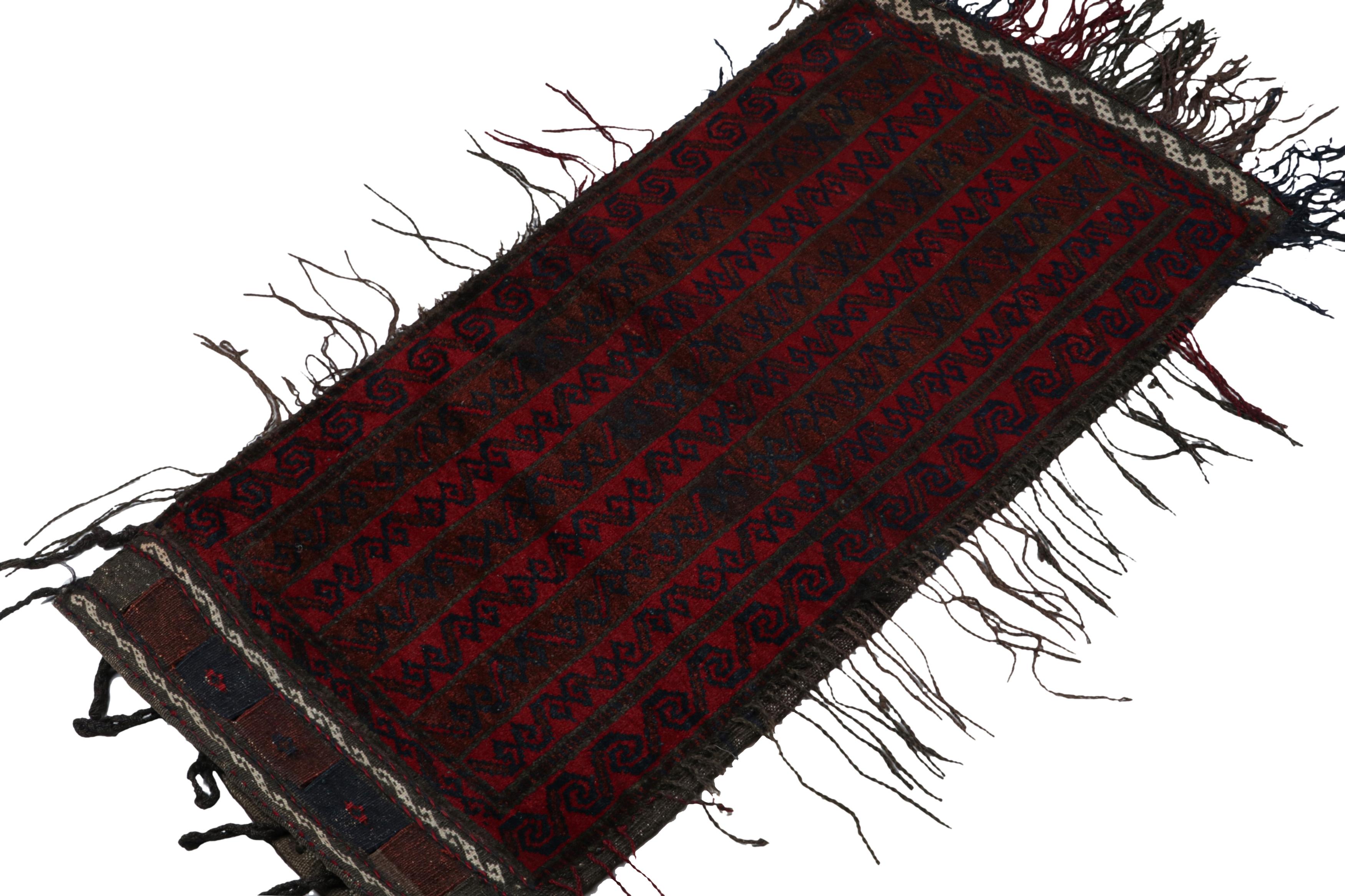 Hand-knotted in wool, this 1x3 Baluch Persian rug of the 1950s is the latest to enter Rug & Kilim’s Antique & Vintage collection.

On the Design:

This vintage rug enjoy rich tones of brown, red and blue with geometric patterns in stripes and