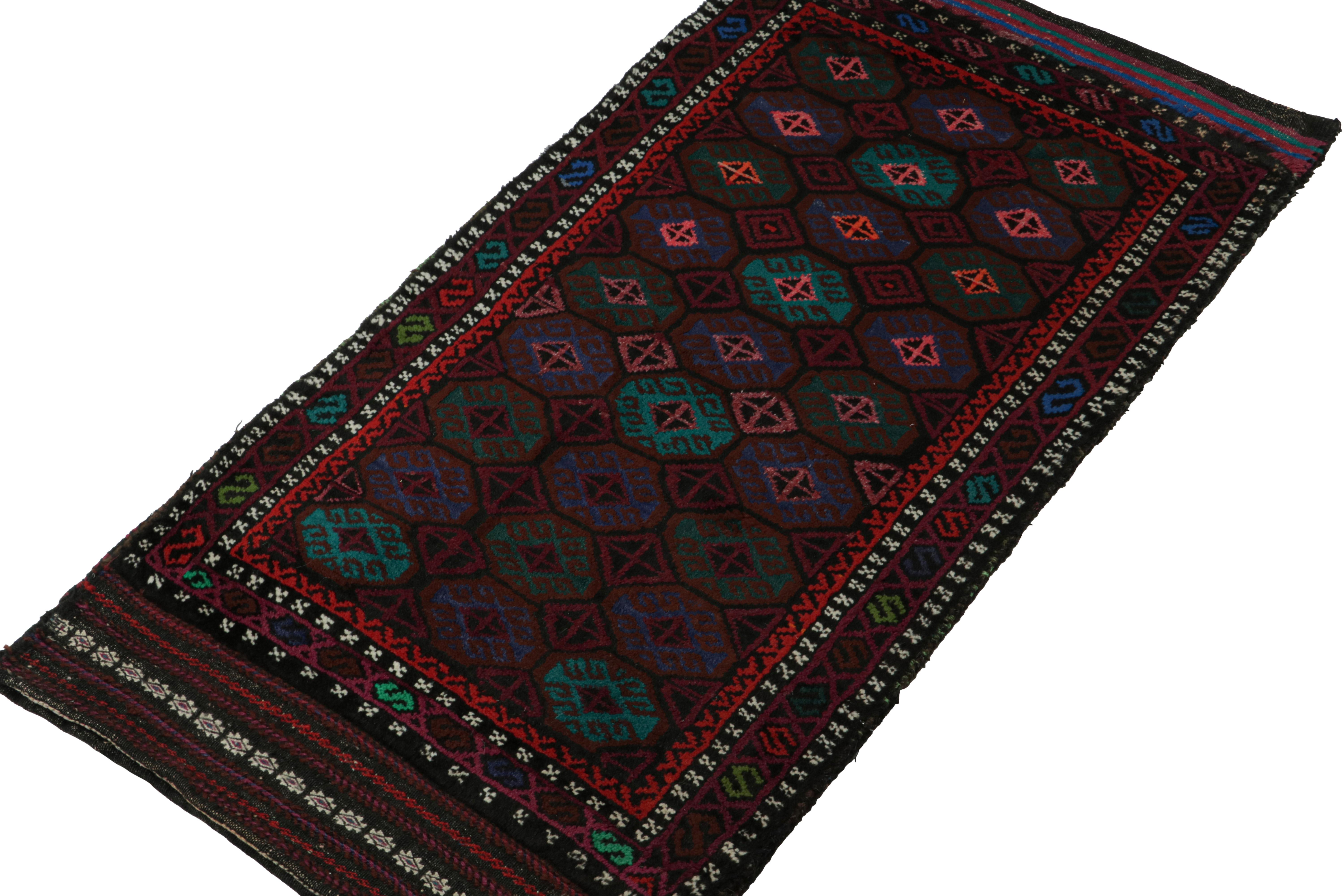 Hand-knotted in wool, this 2x4 Baluch Persian rug of the 1950s is the latest to enter Rug & Kilim’s Antique & Vintage collection.

On the Design:

This vintage Baluch rug carries tribal patterns encased in octagons relishing brown, green, blue &