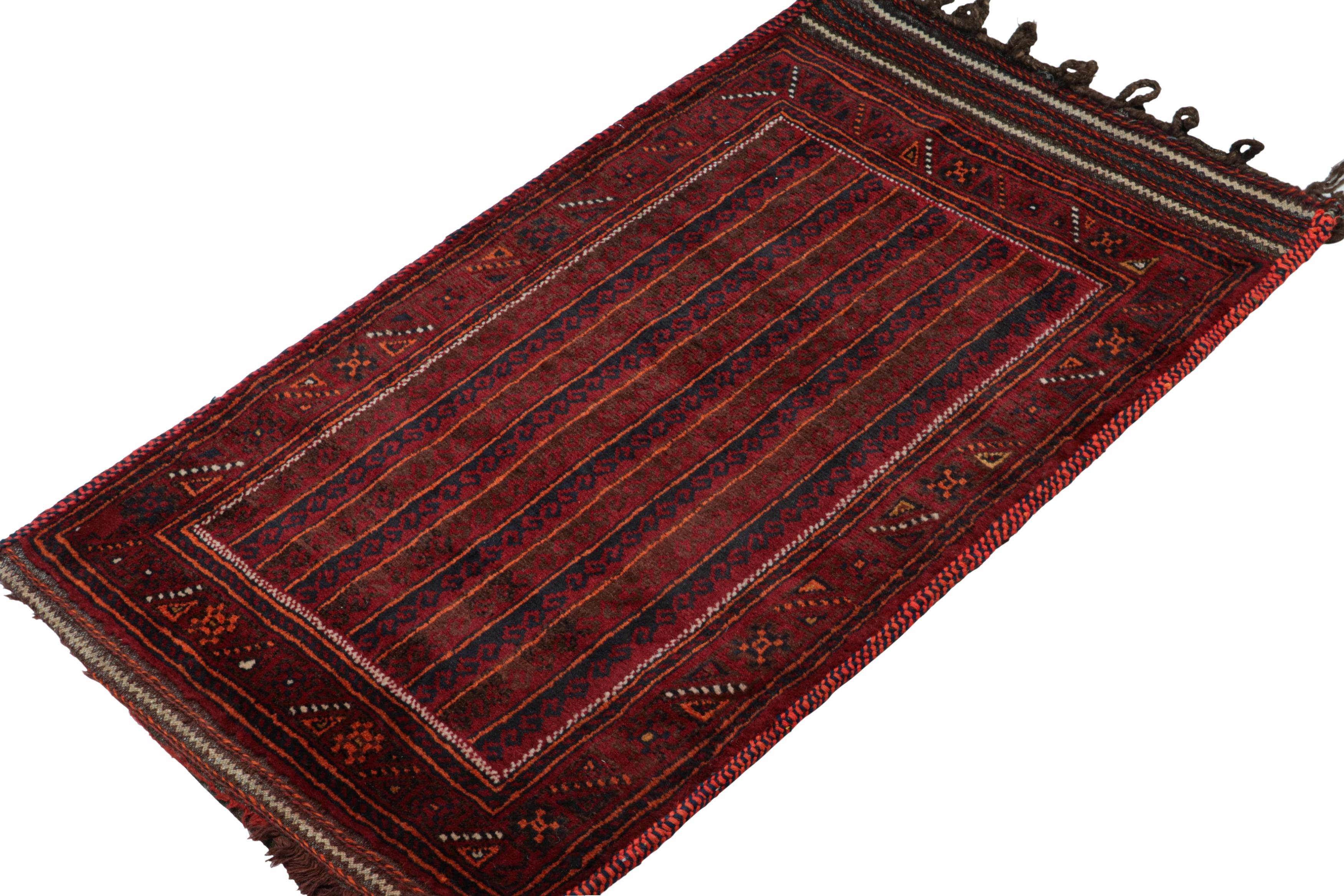 Hand-knotted in wool, this 2x4 Baluch Persian rug of the 1950s is the latest to enter Rug & Kilim’s Antique & Vintage collection.

On the Design:

The piece enjoys a defined movement with tribal patterns in tones of red, blue, black with subtle