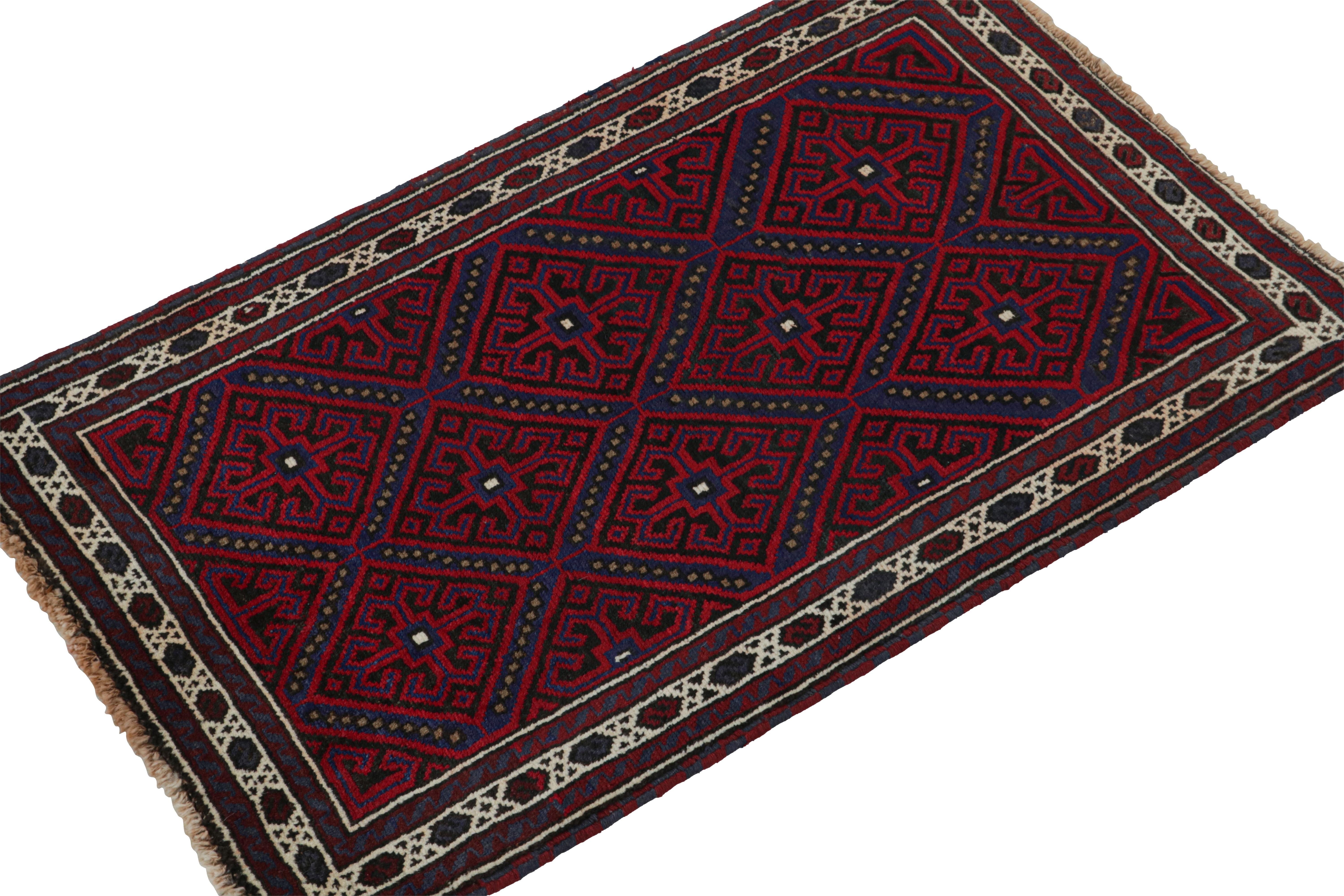 Hand-knotted in wool, this 3x5 Baluch Persian rug of the 1950s is the latest to enter Rug & Kilim’s Antique & Vintage collection.

On the Design:

The piece carries diamond patterns in rich tones of red, blue & black. The field is encased in fine