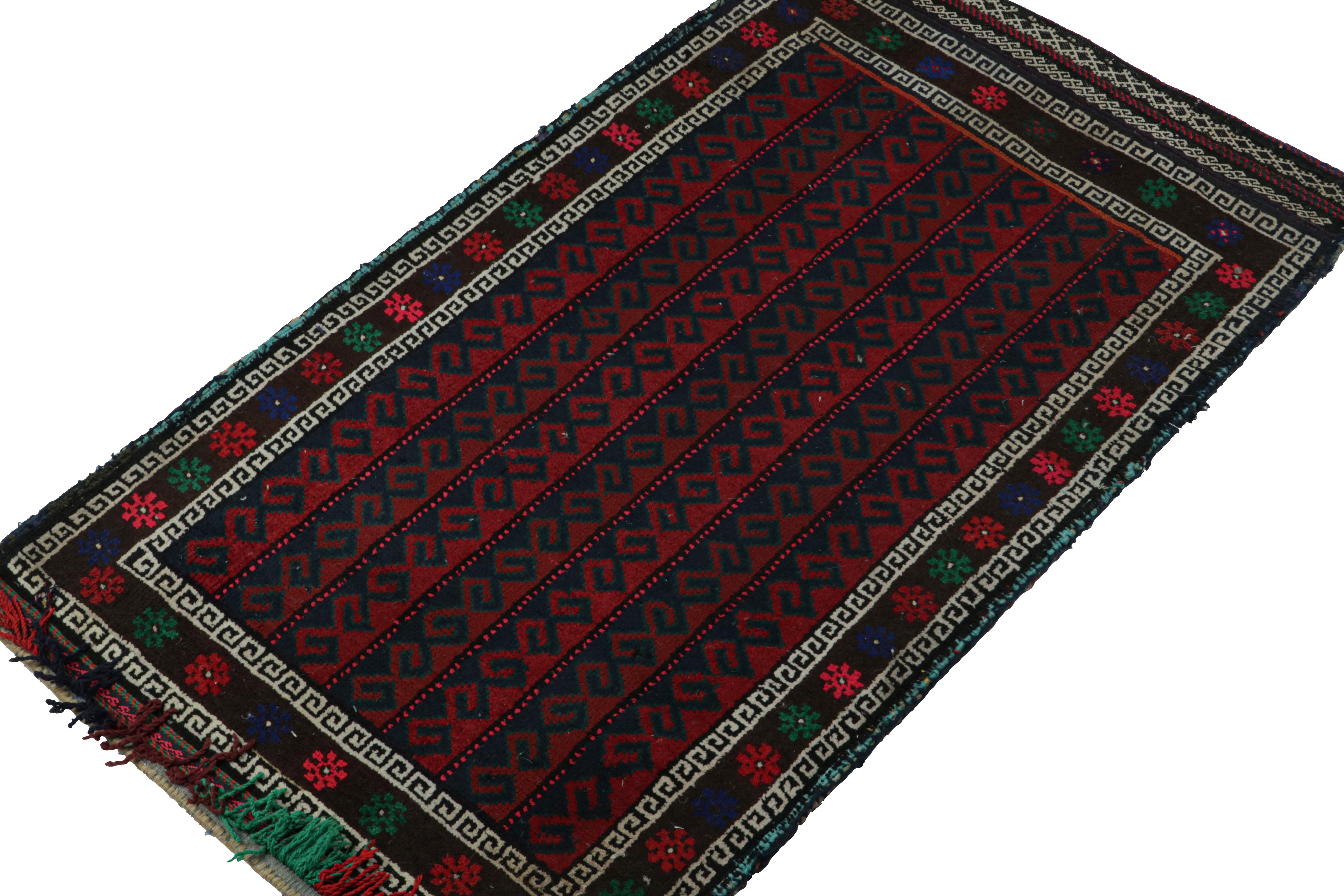 Hand-knotted in wool, this 2x3 Baluch Persian rug of the 1950s is the latest to enter Rug & Kilim’s Antique & Vintage collection.

On the Design:

The vintage Baluch rug carries tribal patterns in rich tones of red, white, blue & black. The field is