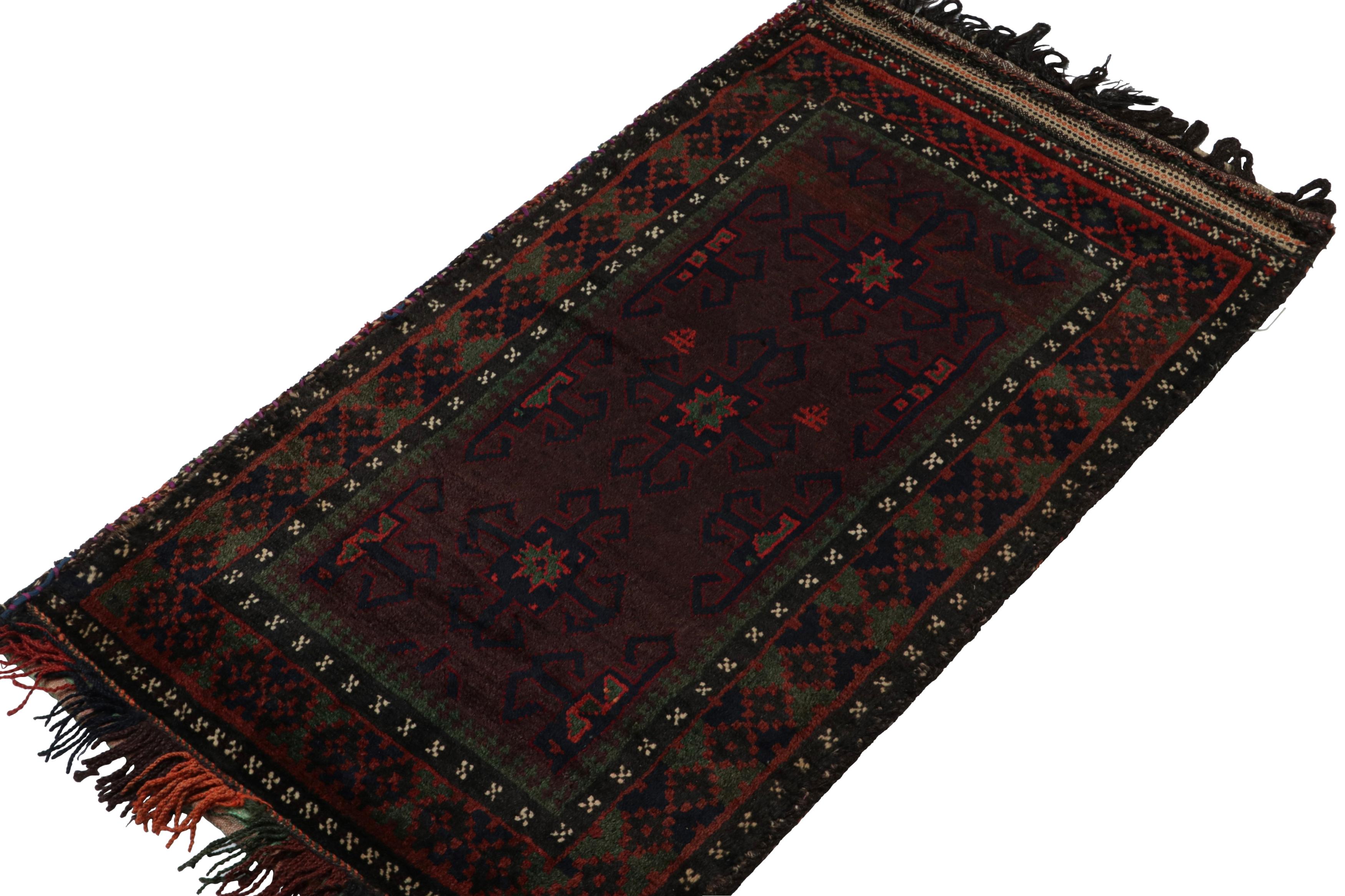 Hand-knotted in wool, this 2x4 Baluch Persian rug of the 1950s is the latest to enter Rug & Kilim’s Antique & Vintage collection.

On the Design:

The vintage Baluch rug carries tribal patterns in rich tones of red, green, blue & black. The field is
