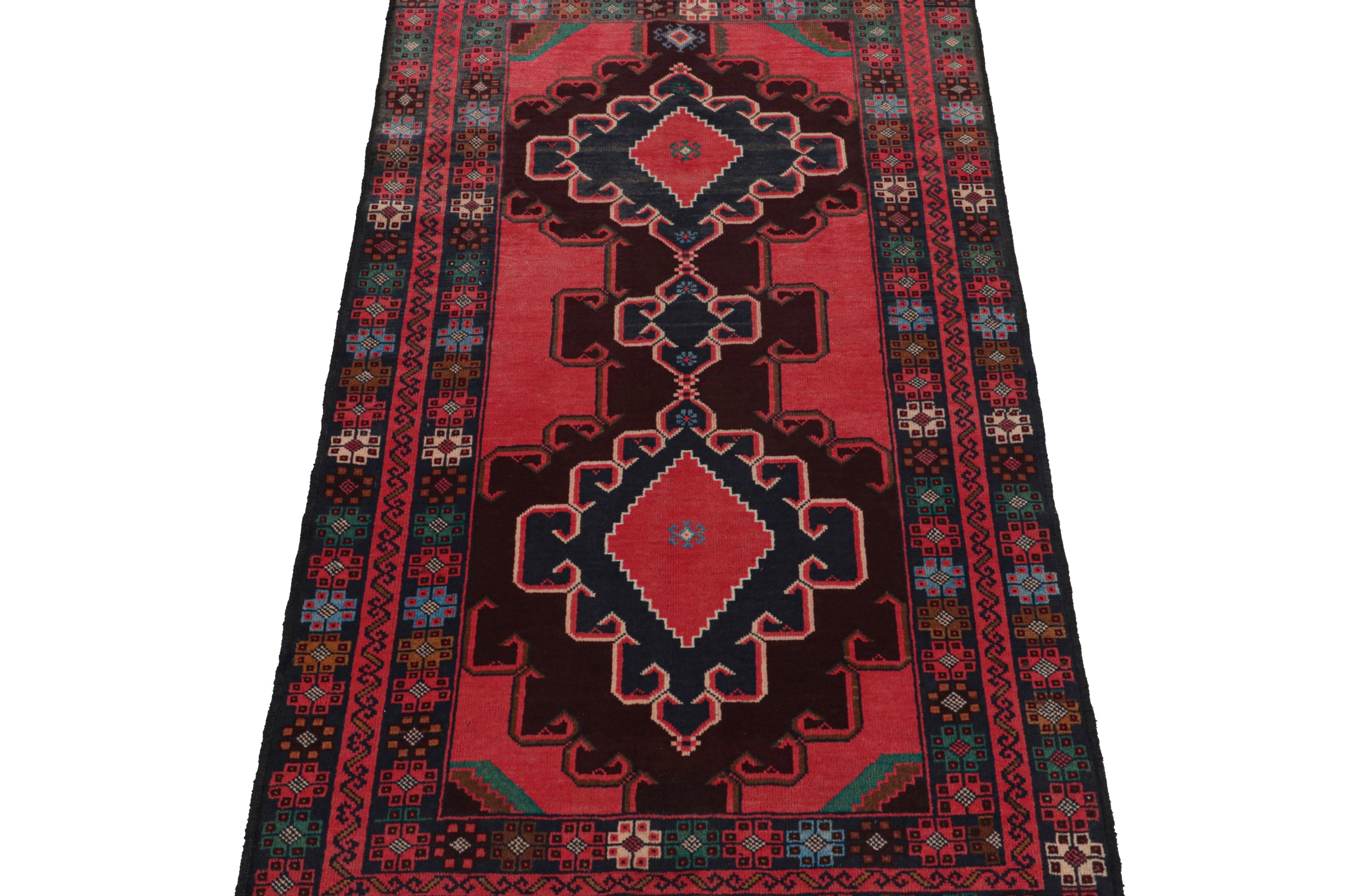 Hand-knotted in wool, this 3x6 Baluch Afghan runner of the 1950s is the latest to enter Rug & Kilim’s Antique & Vintage collection.

On the Design:

The piece carries tribal patterns in rich tones of blue & brown on red. The borders carry
