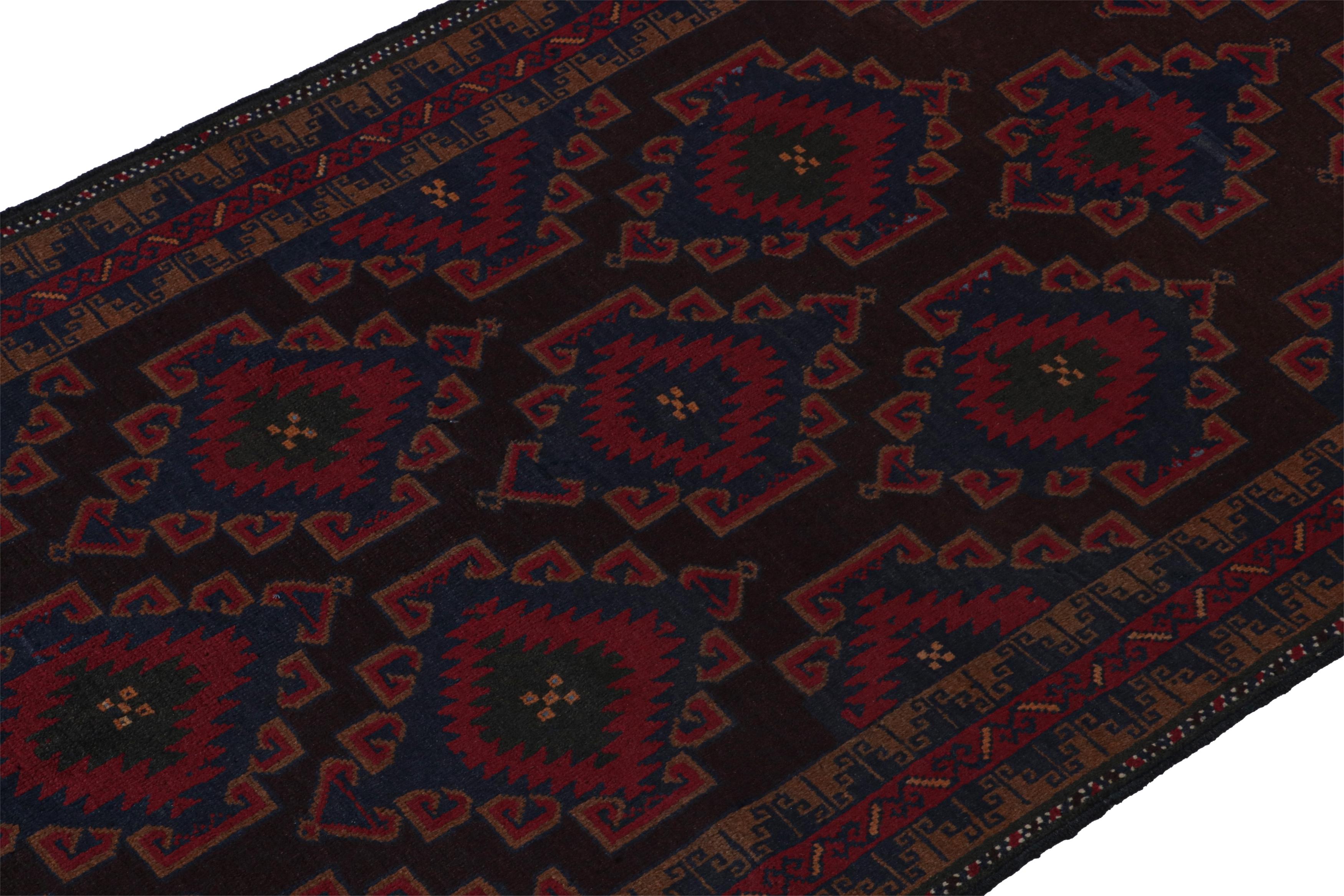 Hand-Knotted Vintage Baluch Persian runner in Red & Blue on Black Patterns from Rug & Kilim For Sale
