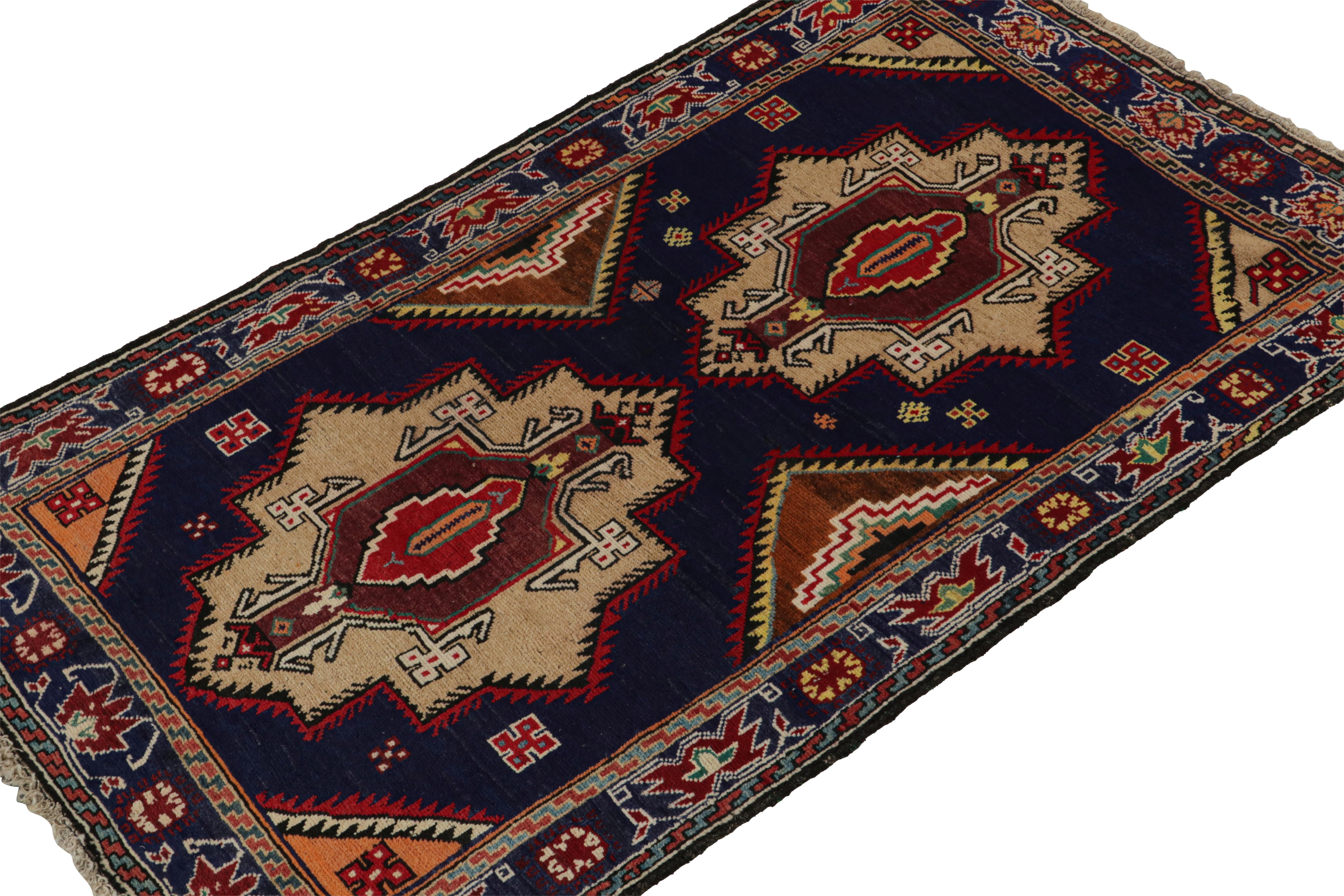 Hand-knotted in wool and goat hair circa 1950-1960, this 4x7 vintage Baluch tribal rug is a new curation from Rug & Kilim. 

On the Design:

This design enjoys rich brown medallions on a navy blue field, with red and white in the most present accent
