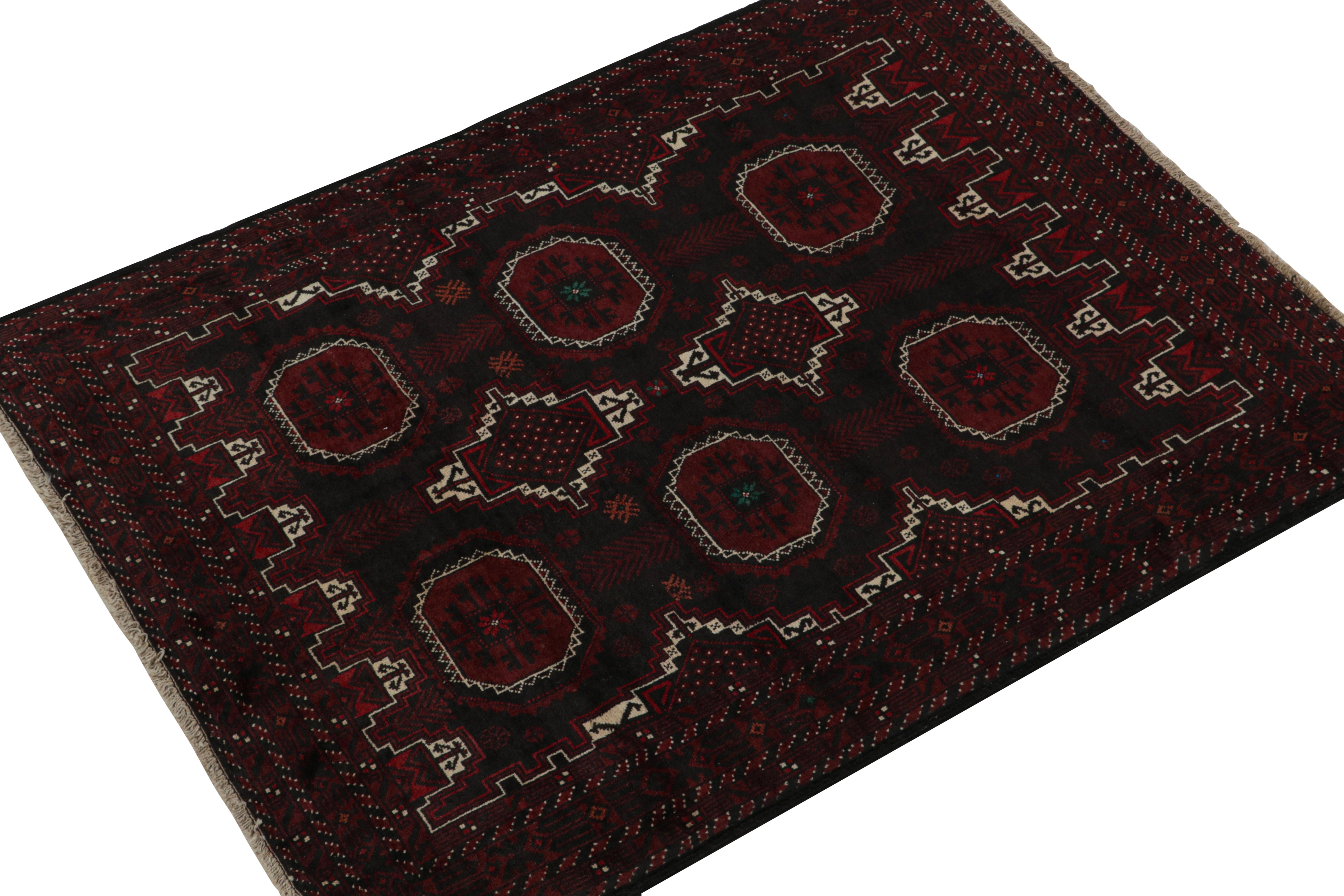 Hand-knotted in wool & goat hair, this vintage tribal rug of the 1950s is a coveted addition to Rug & Kilim’s Antique & Vintage collection. 

On the Design: 

Coming from the Baluch tribe, this 4x5 rug boasts patterns in rich tones of red, black