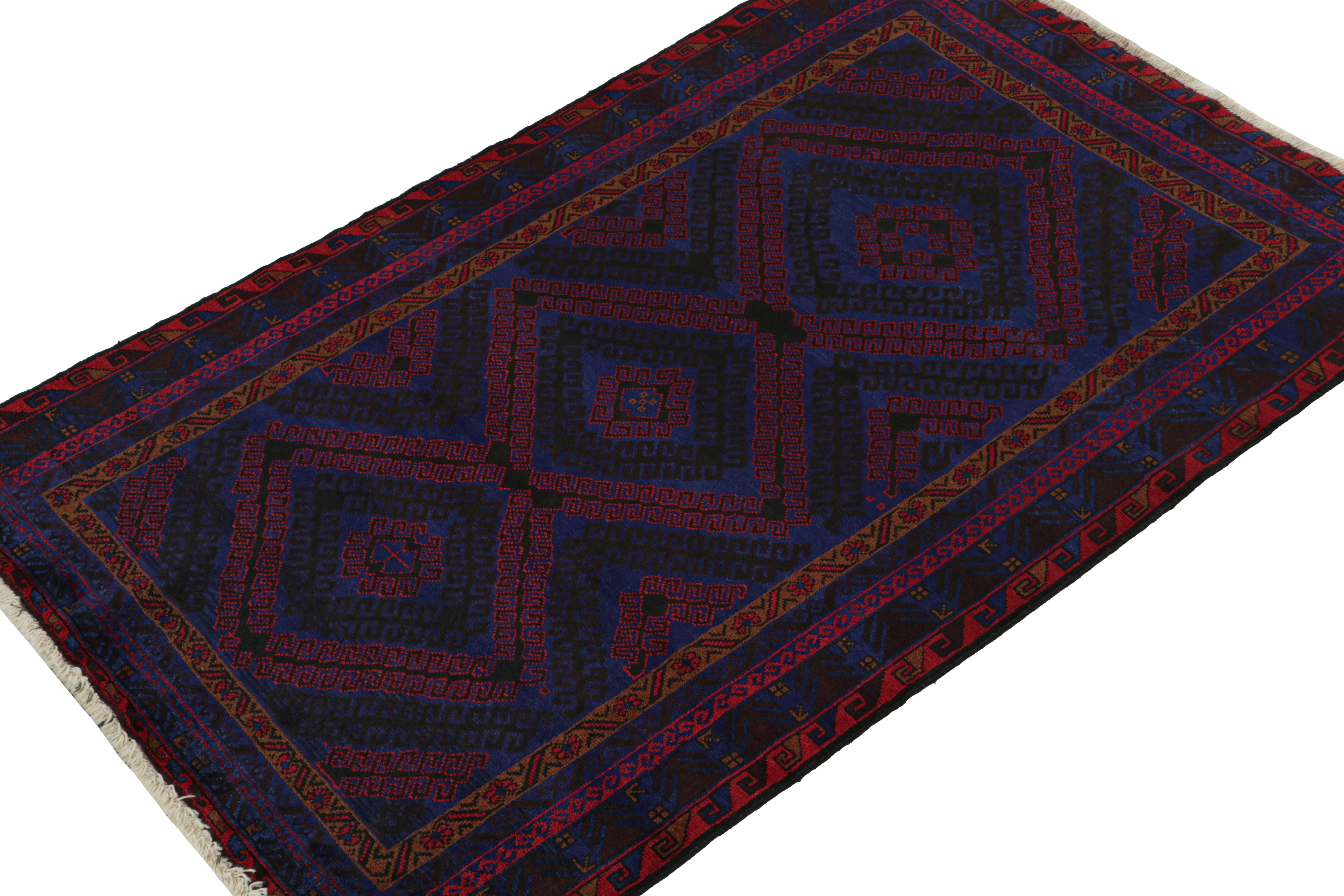 Hand-knotted in wool & goat hair, this vintage tribal rug of the 1950s is a coveted addition to Rug & Kilim’s Antique & Vintage collection. 

On the Design:
 
Coming from the Baluch tribe, this 4x6 rug boasts diamond patterns in rich tones of red,