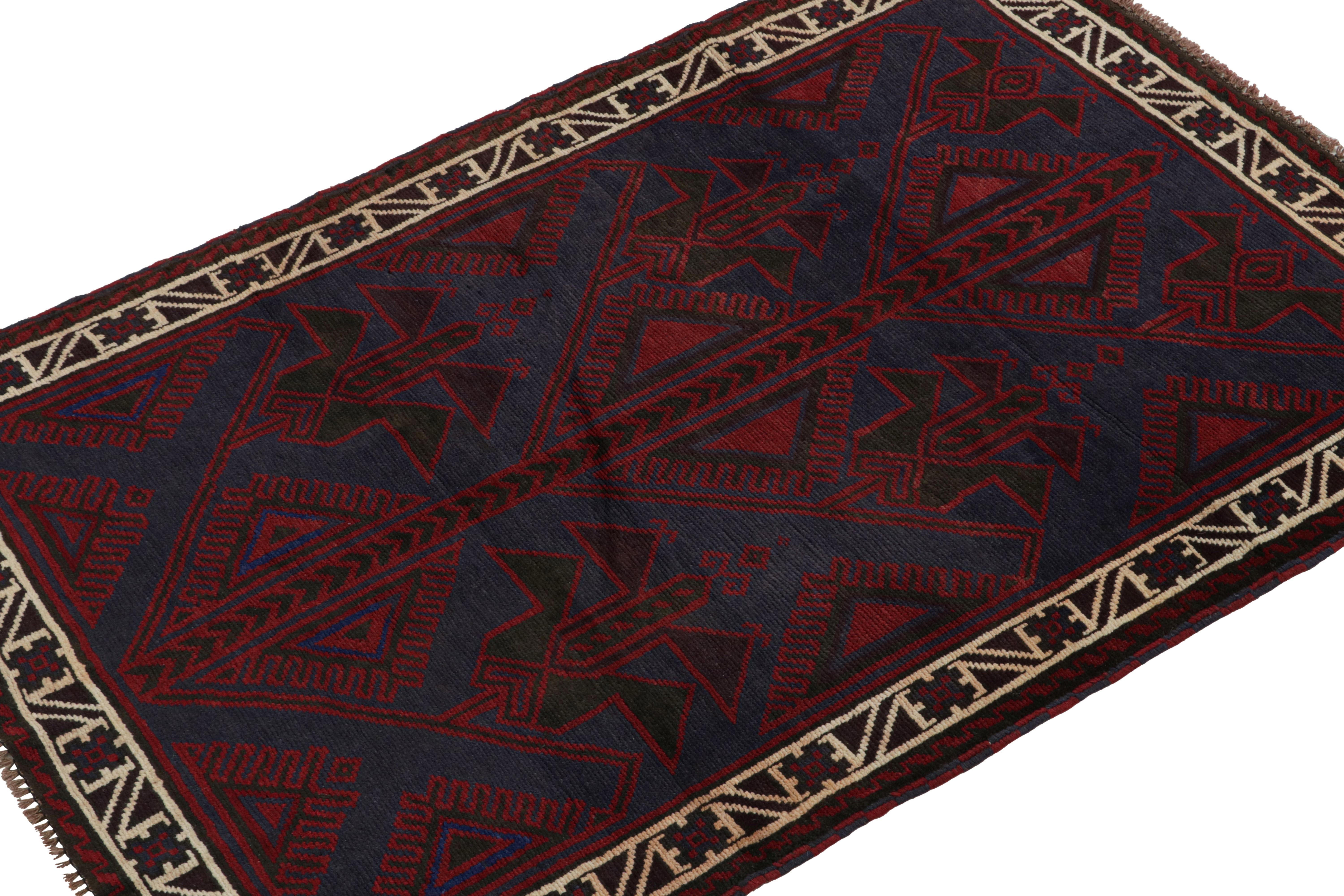 Hand-knotted in wool and goat hair circa 1950-1960, this 4x6 vintage Baluch tribal rug is a new curation from Rug & Kilim.

On the Design: 

This piece enjoys red and blue geometric patterns, and a rich border with a meander. Its colors are