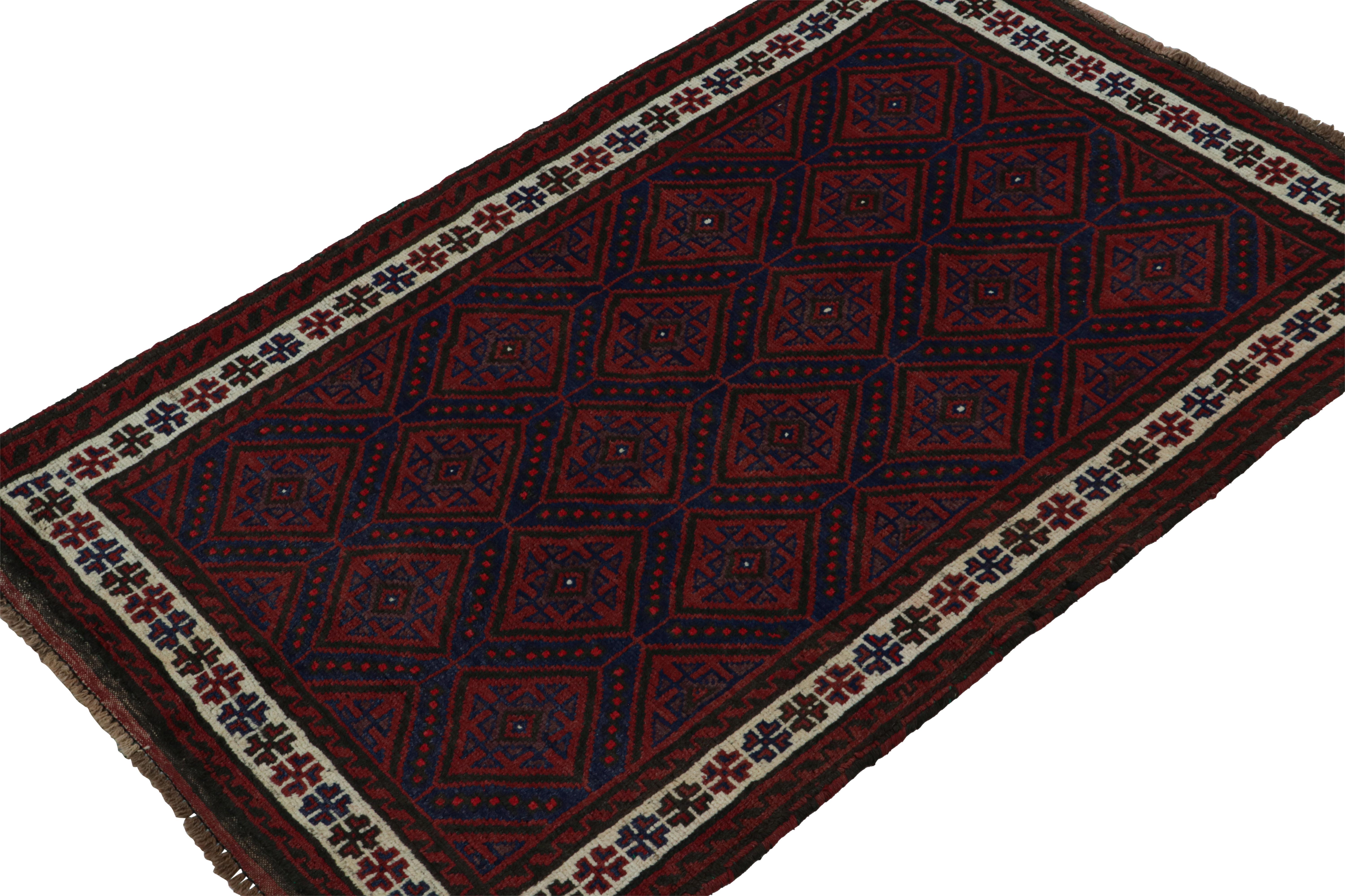 Hand-knotted in wool & goat hair, this vintage tribal rug of the 1950s is a coveted addition to Rug & Kilim’s Antique & Vintage collection. 

On the Design:

Coming from the Baluch tribe, this 4x6 rug boasts traditional patterns in rich red & navy