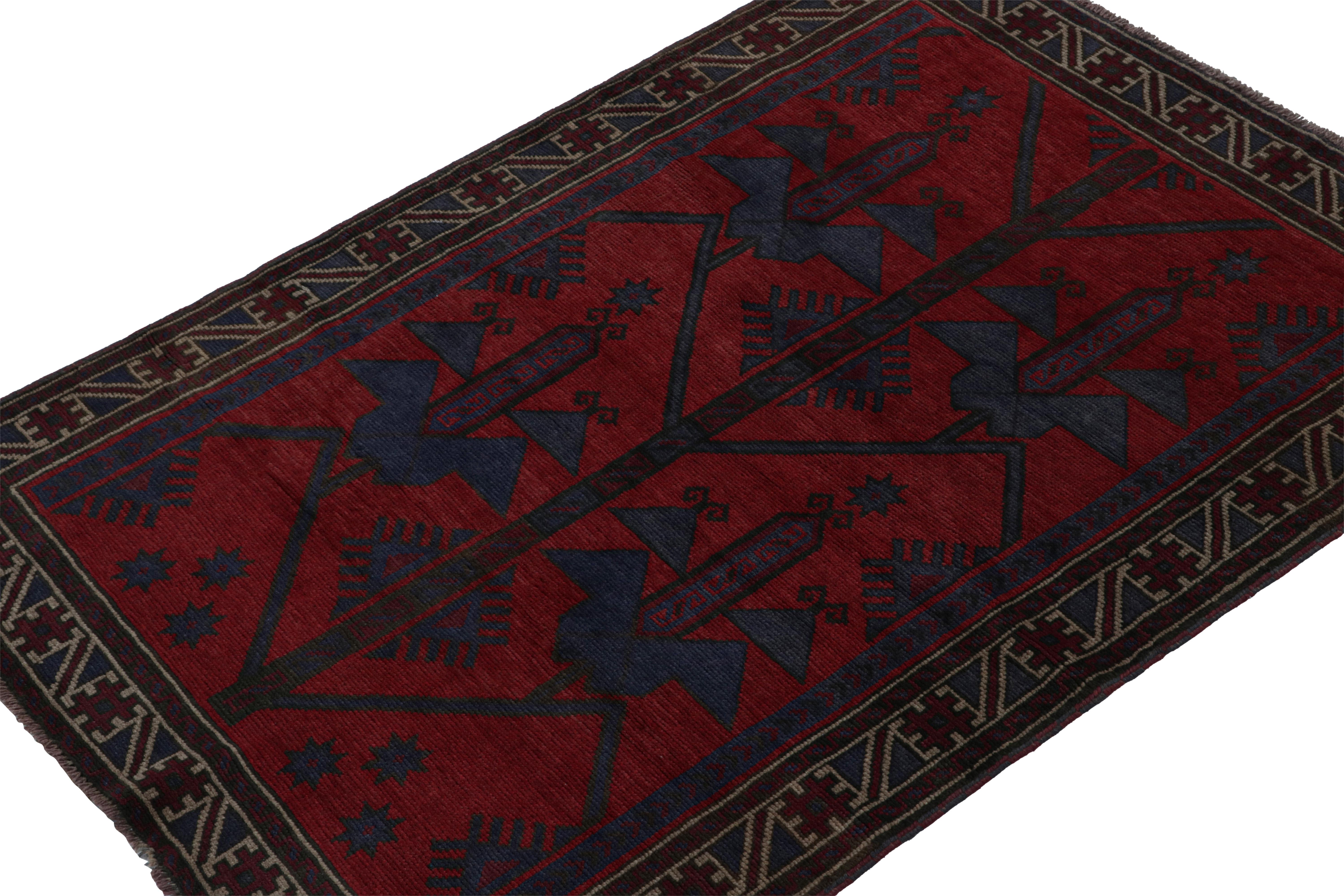 Hand-knotted in wool & goat hair, this vintage tribal rug of the 1950s is a coveted addition to Rug & Kilim’s Antique & Vintage collection. 

On the Design: 

Coming from the Baluch tribe, this 5x6 rug boasts traditional patterns in rich red & navy