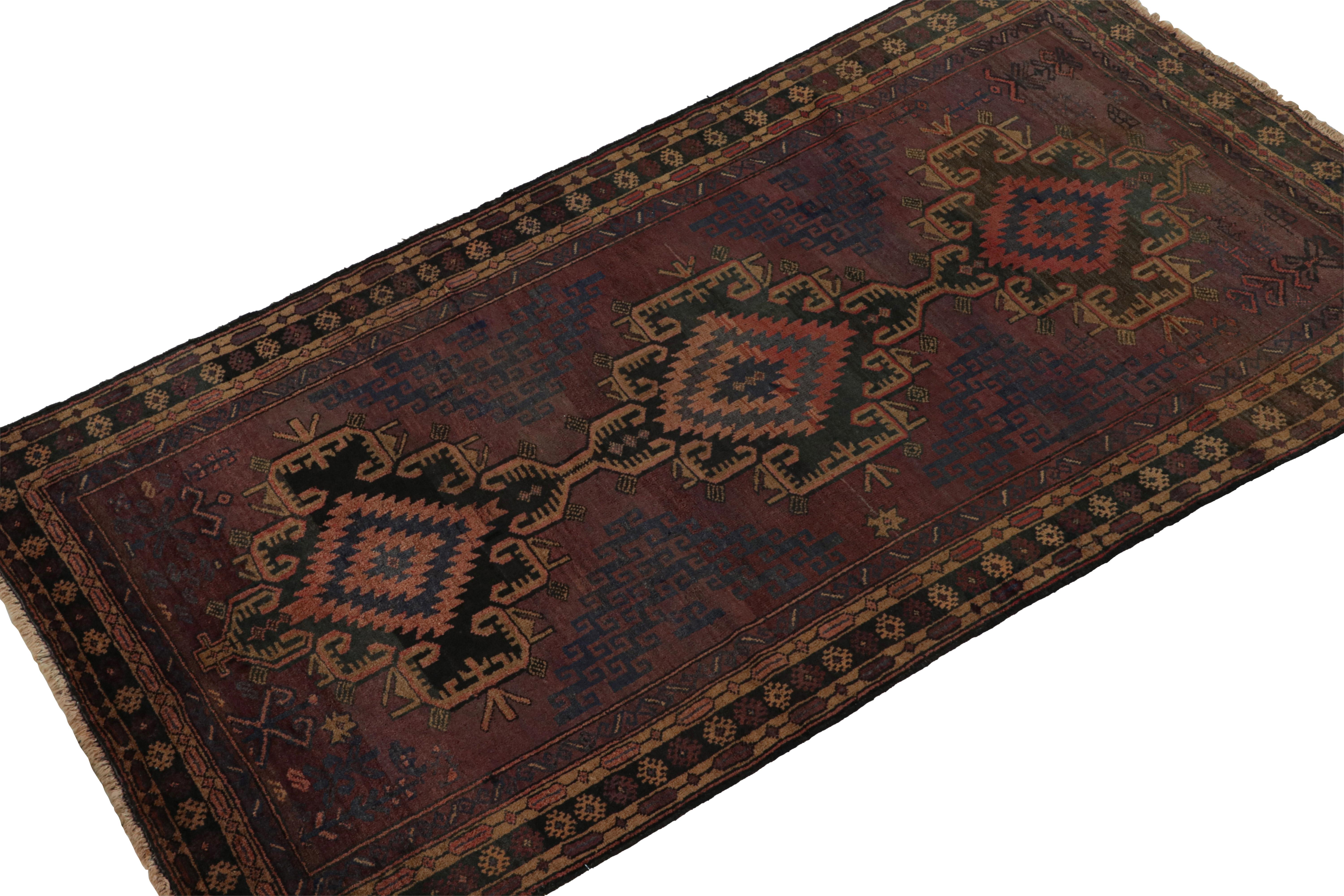 Hand-knotted in wool and goat hair circa 1950-1960, this 4x7 vintage Baluch tribal rug is an exciting new curation from Rug & Kilim. 

On the Design: 

This runner rug enjoys a play of bold medallions and geometric patterns in rich red, navy blue
